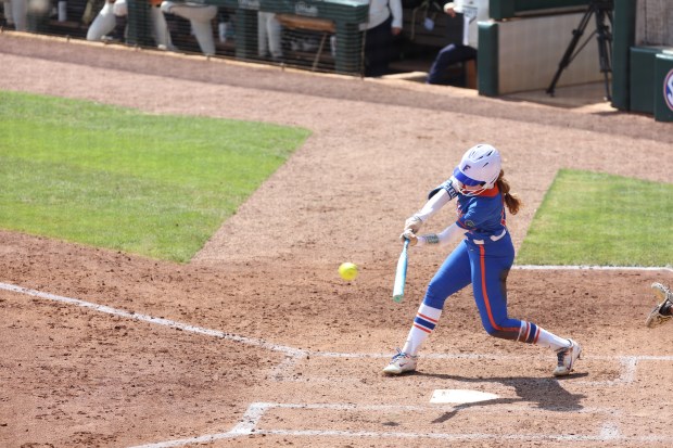 Florida shortstop Kenleigh Cahalan connects on a 3-2 pitch for a three-run home to give the Gators a 3-0 lead en route to a 8-0 victory over Georgia Tech Saturday in the NCAA Regional at Katie Seashole Pressly Stadium in Gainesville. (Hannah White / UF's University Athletics Association)