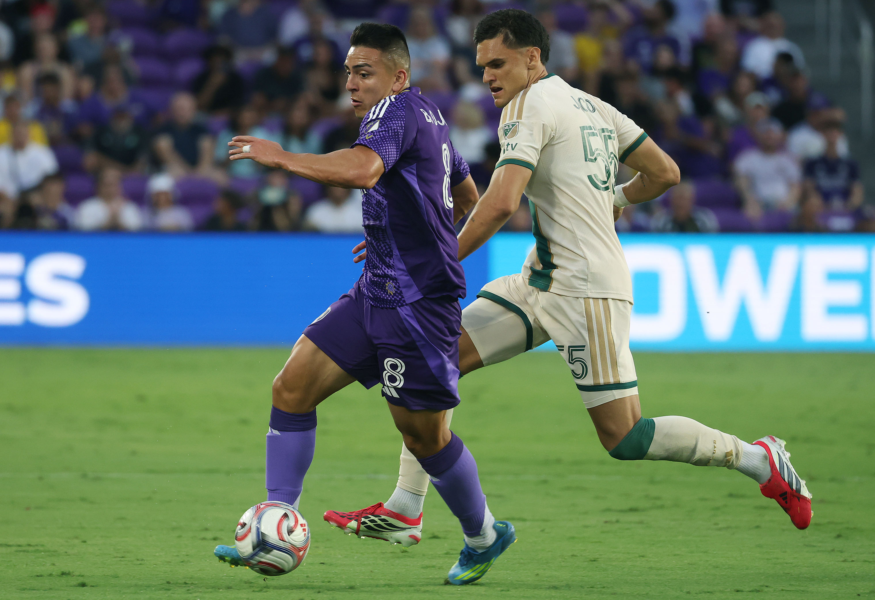 Orlando player Braian Ojeda (8) moves the ball in front...