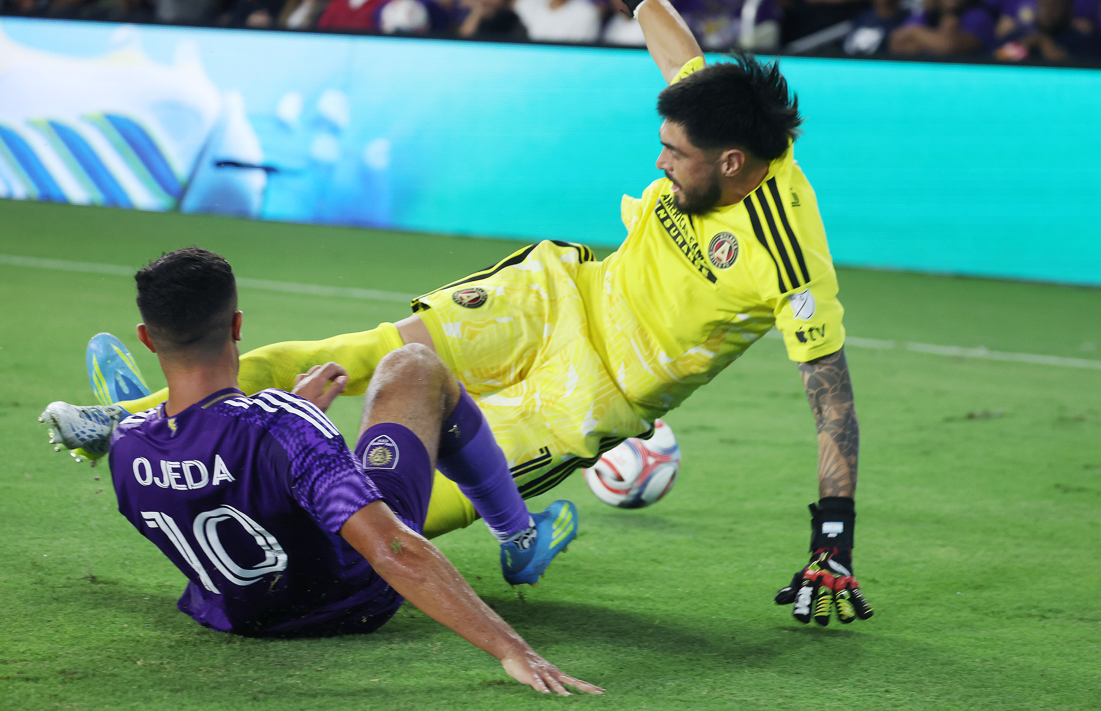 Orlando player Martin Ojeda (10) collides with Atlanta goalkeeper Lucas...