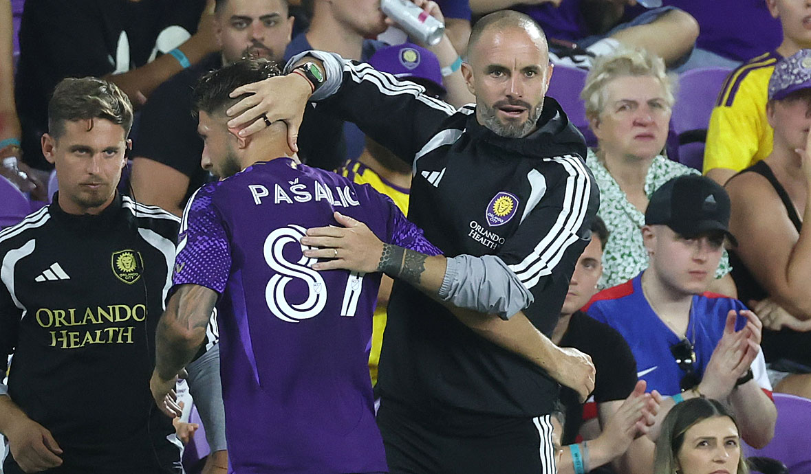 Orlando coach Martin Perelman (right) hugs Orlando player Marco Pasalic...
