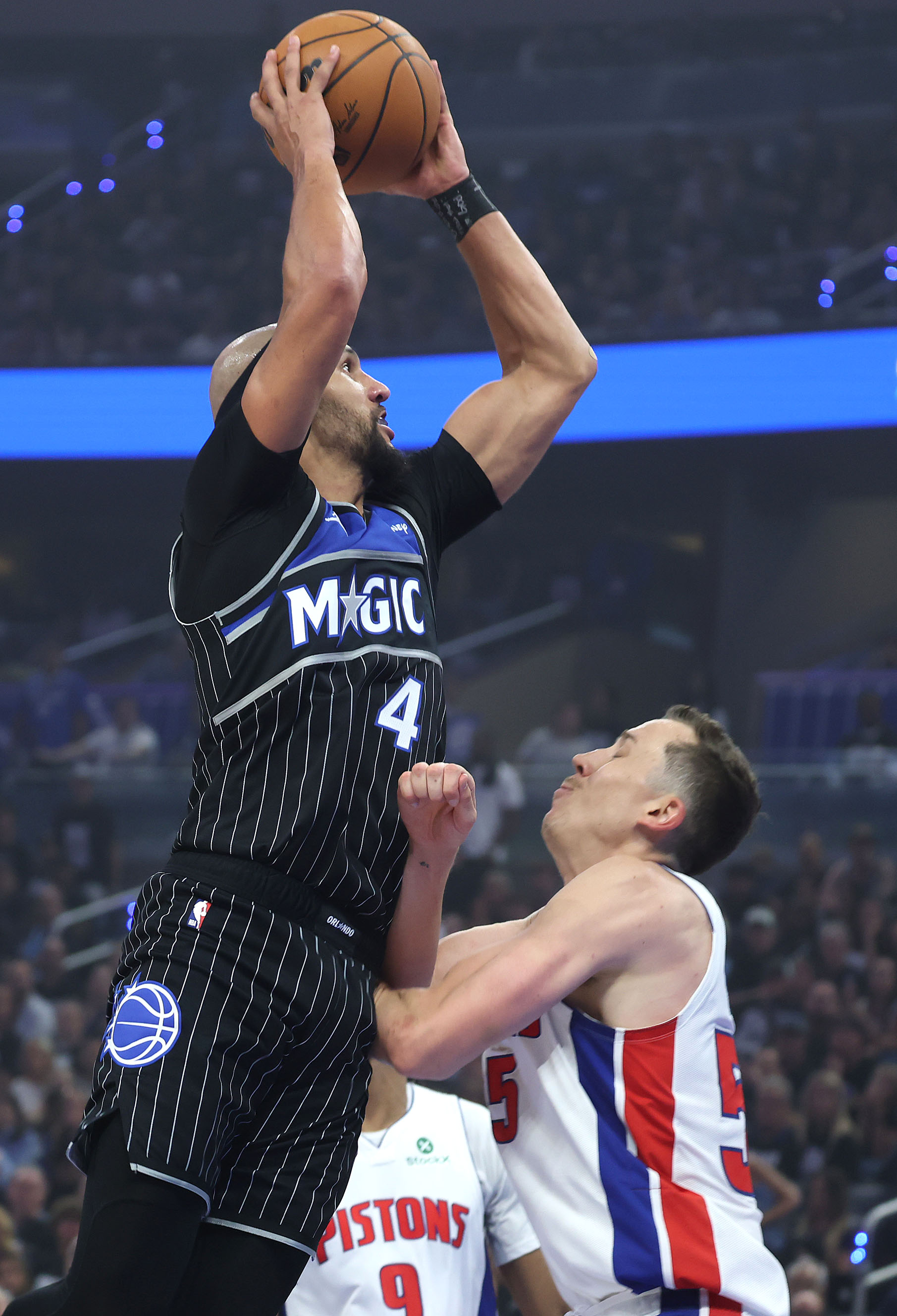 Orlando guard Jalen Suggs (4) shoots over Detroit guard Duncan...