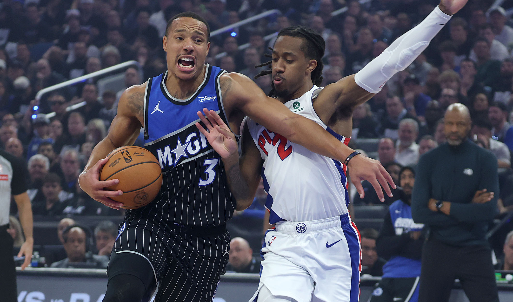 Orlando guard Desmond Bane (3) pushes past Detroit guard Dannis...