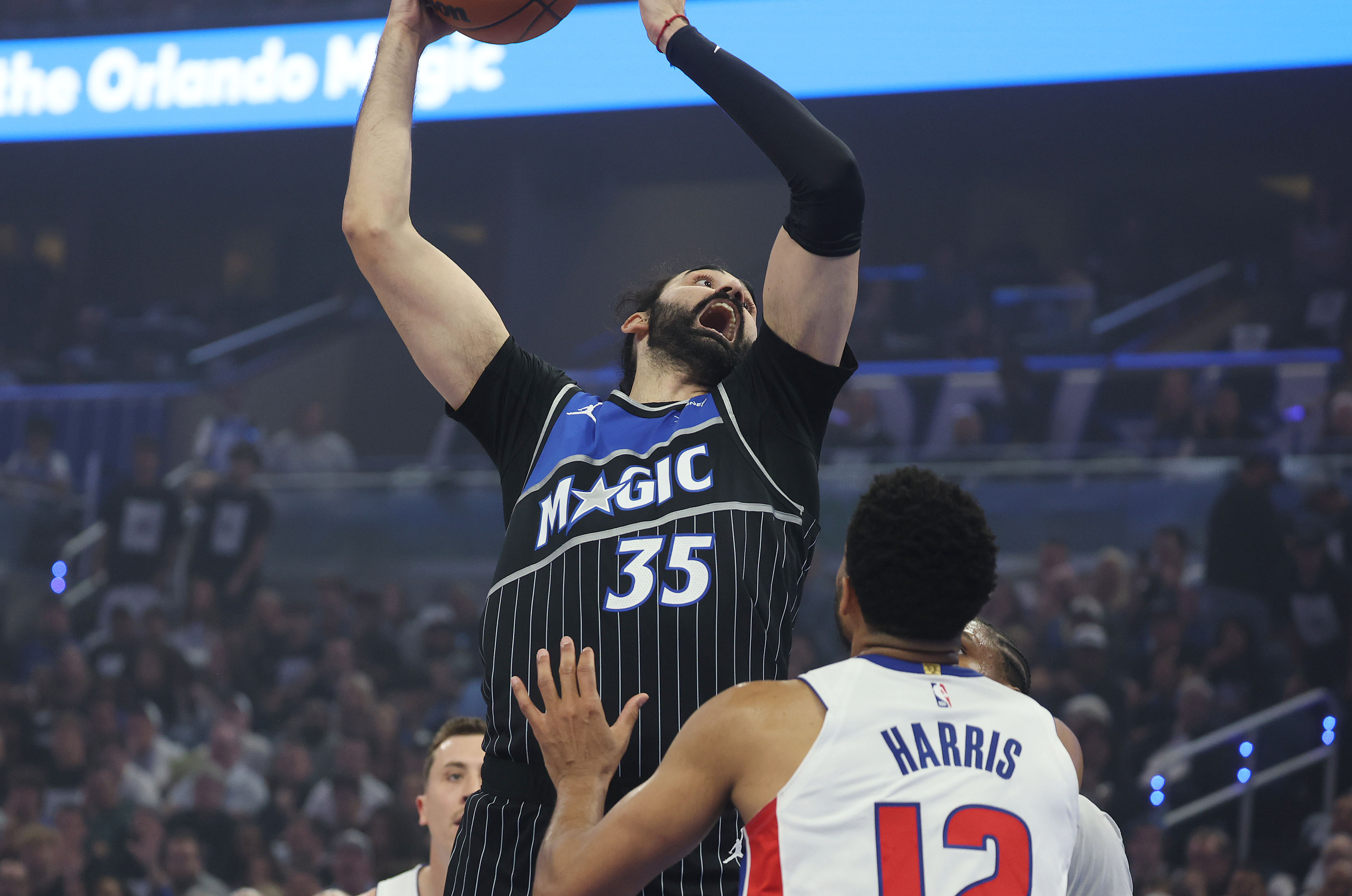 Orlando center Goga Bitadze (35) reaches for a rebound over...