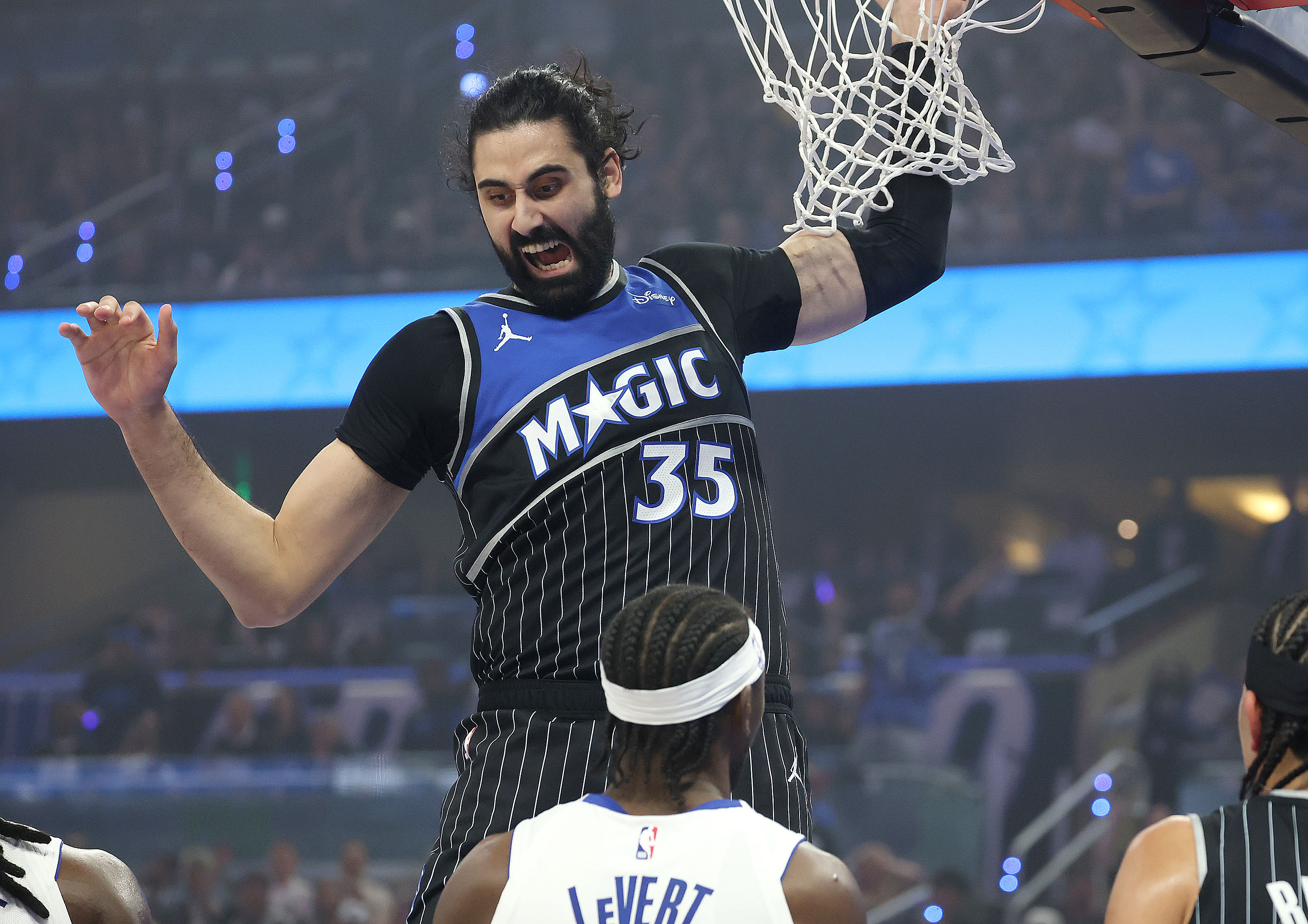 Orlando center Goga Bitadze (35) screams after scoring over Detroit...