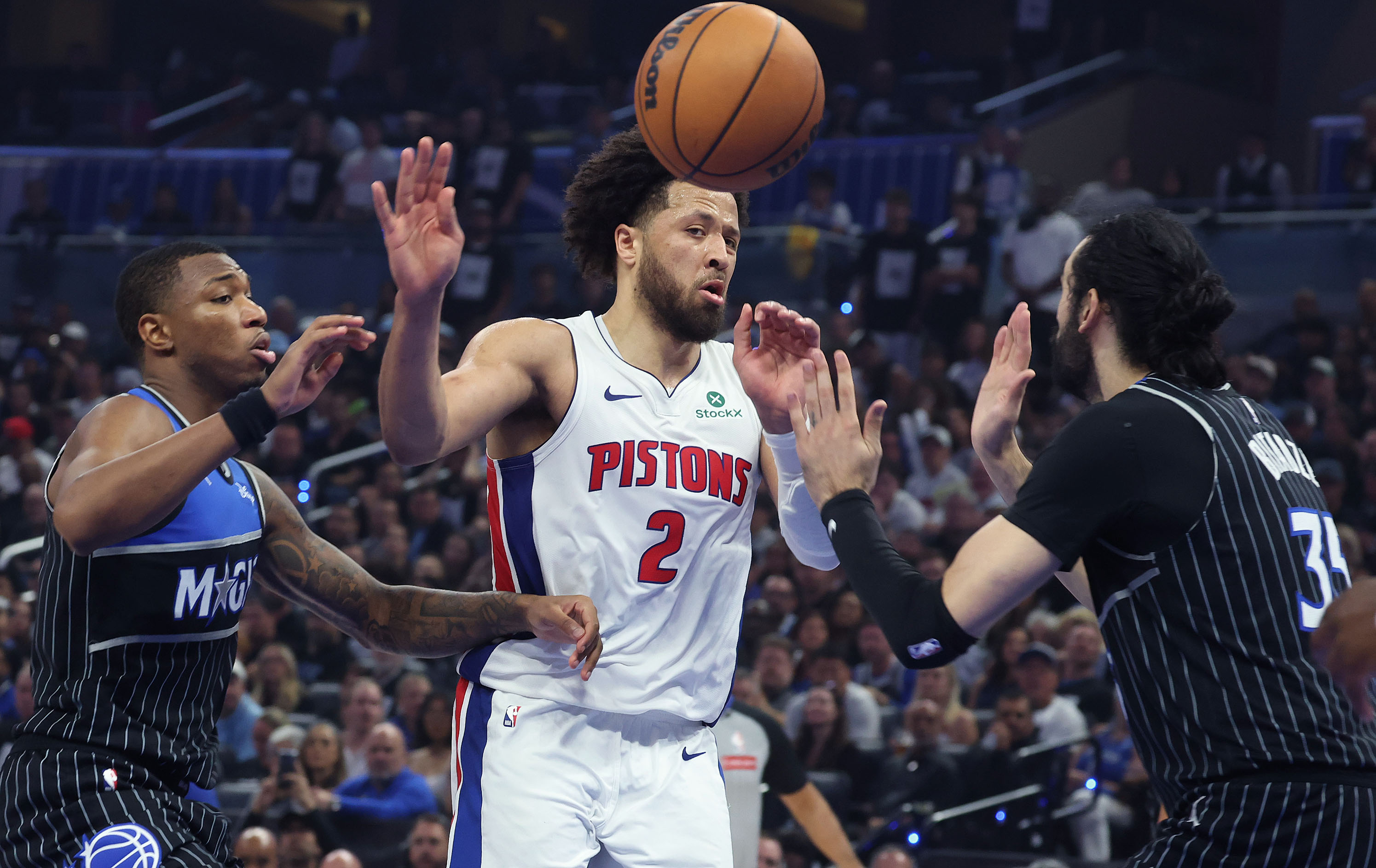 Detroit guard Cade Cunningham (2) passes during the Detroit Pistons...