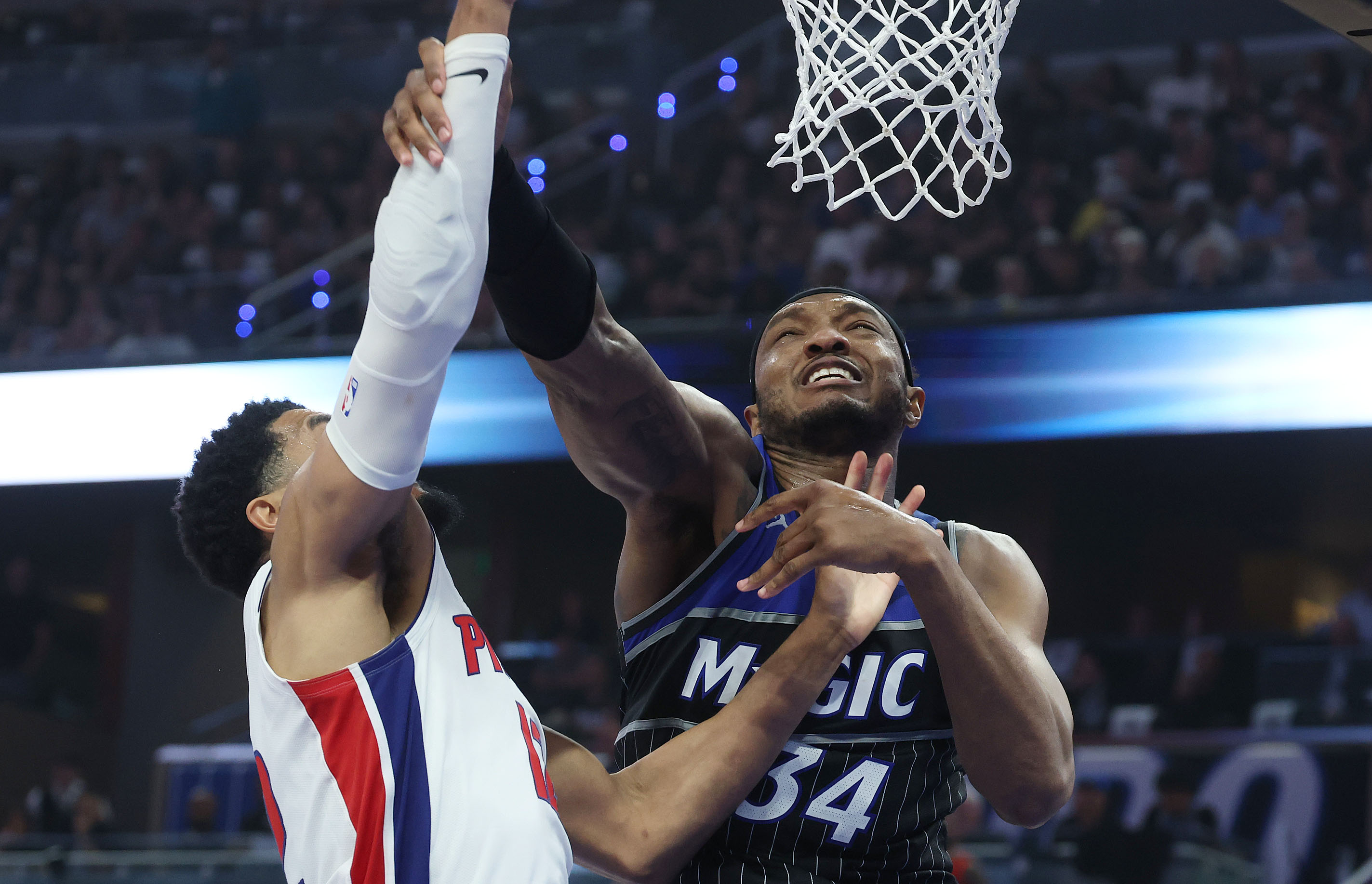 Orlando center Wendell Carter Jr. (34) fouls Detroit forward Tobias...