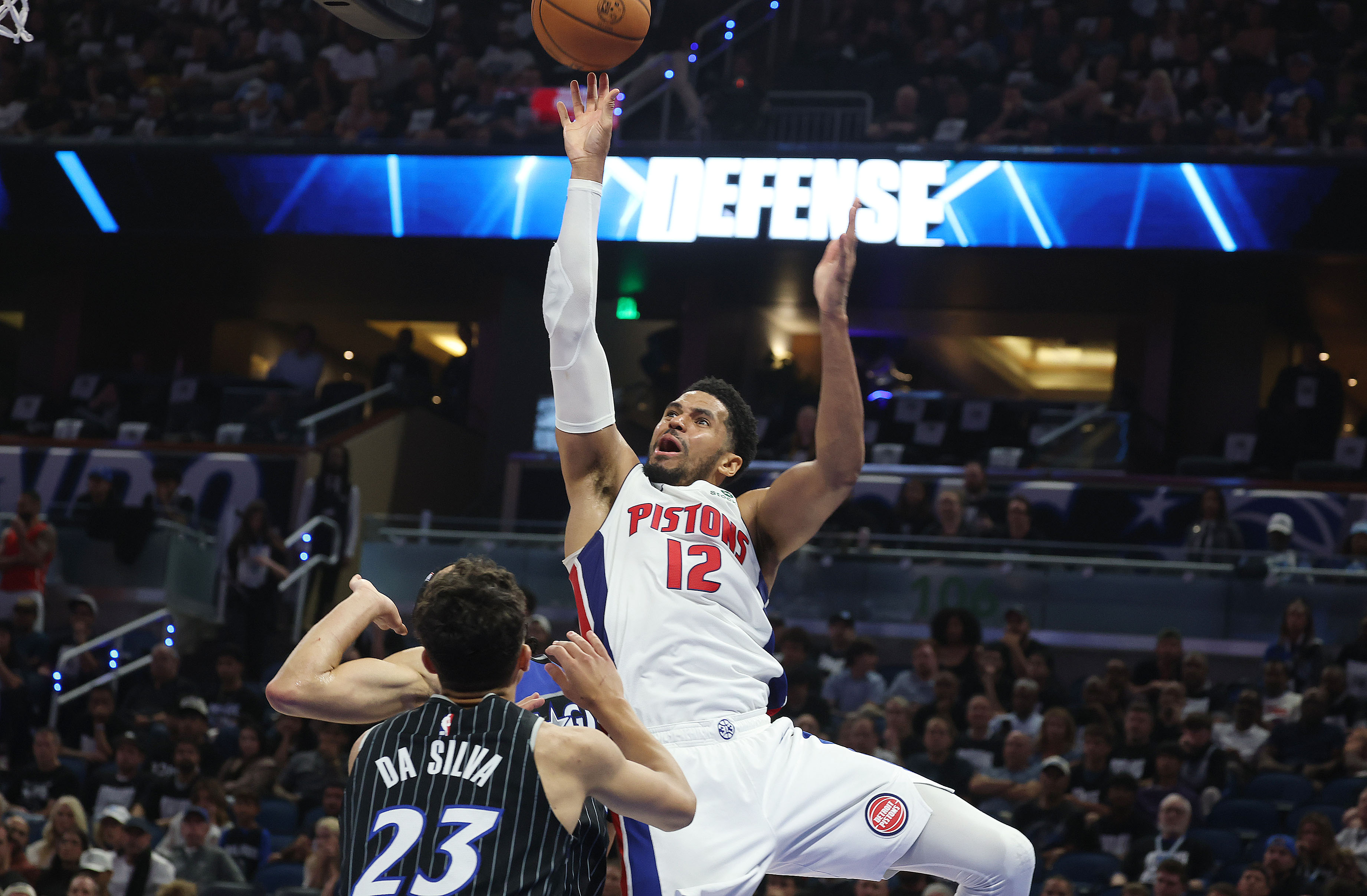 Detroit forward Tobias Harris (12) shoots over Orlando forward Tristan...