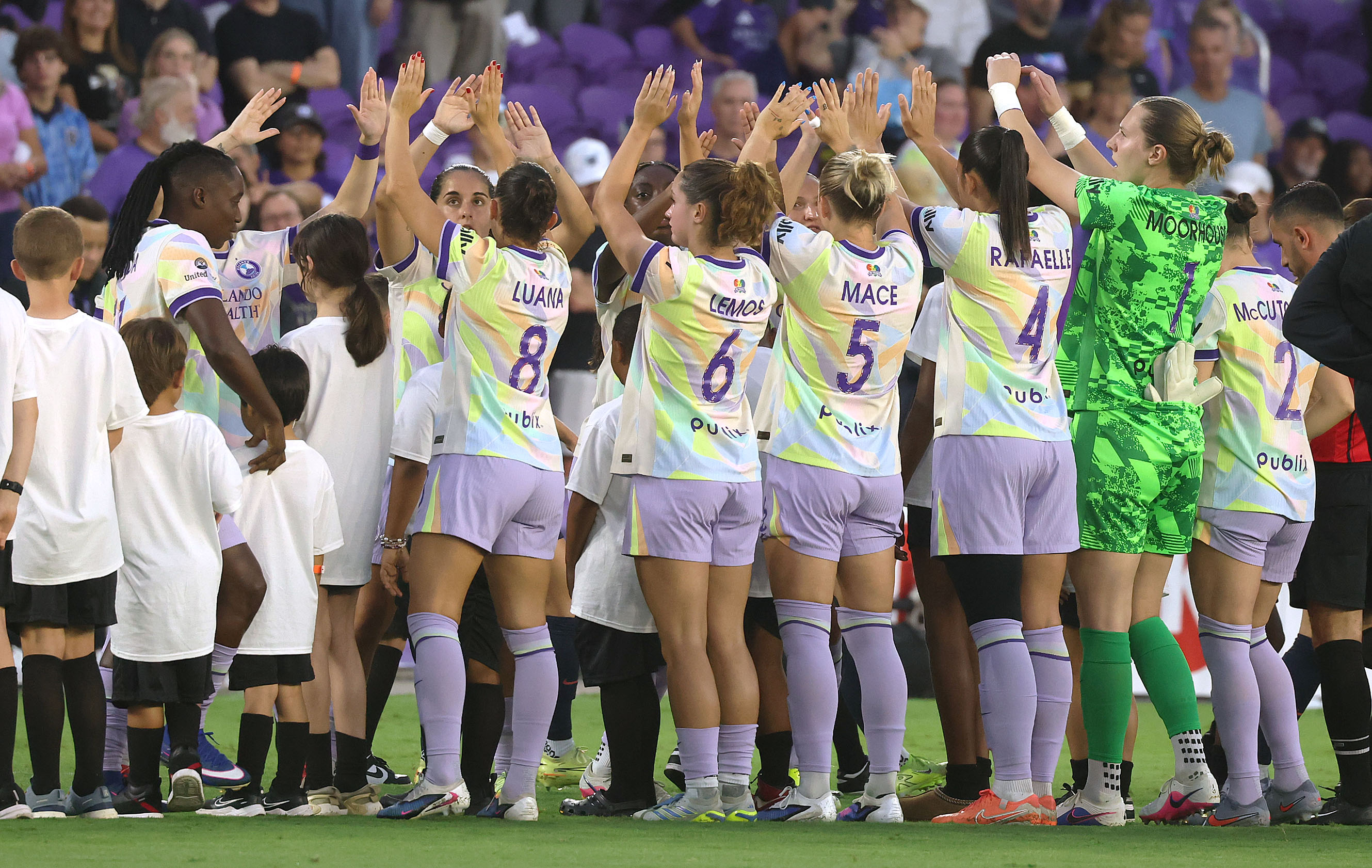Teams greet before the start of the Bay FC at...