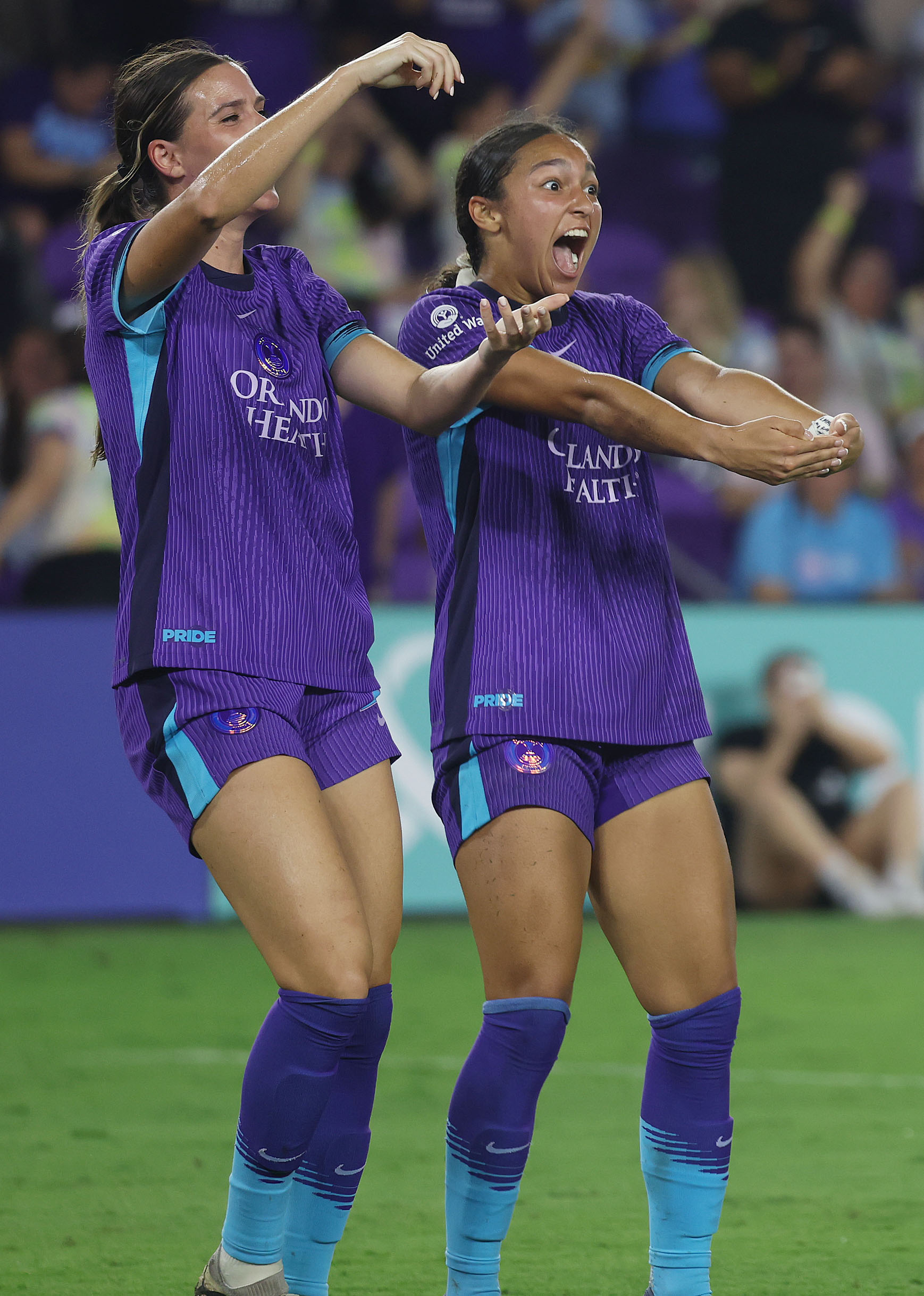 Orlando players Julie Doyle (left) and Seven Castain (right) celebrate...