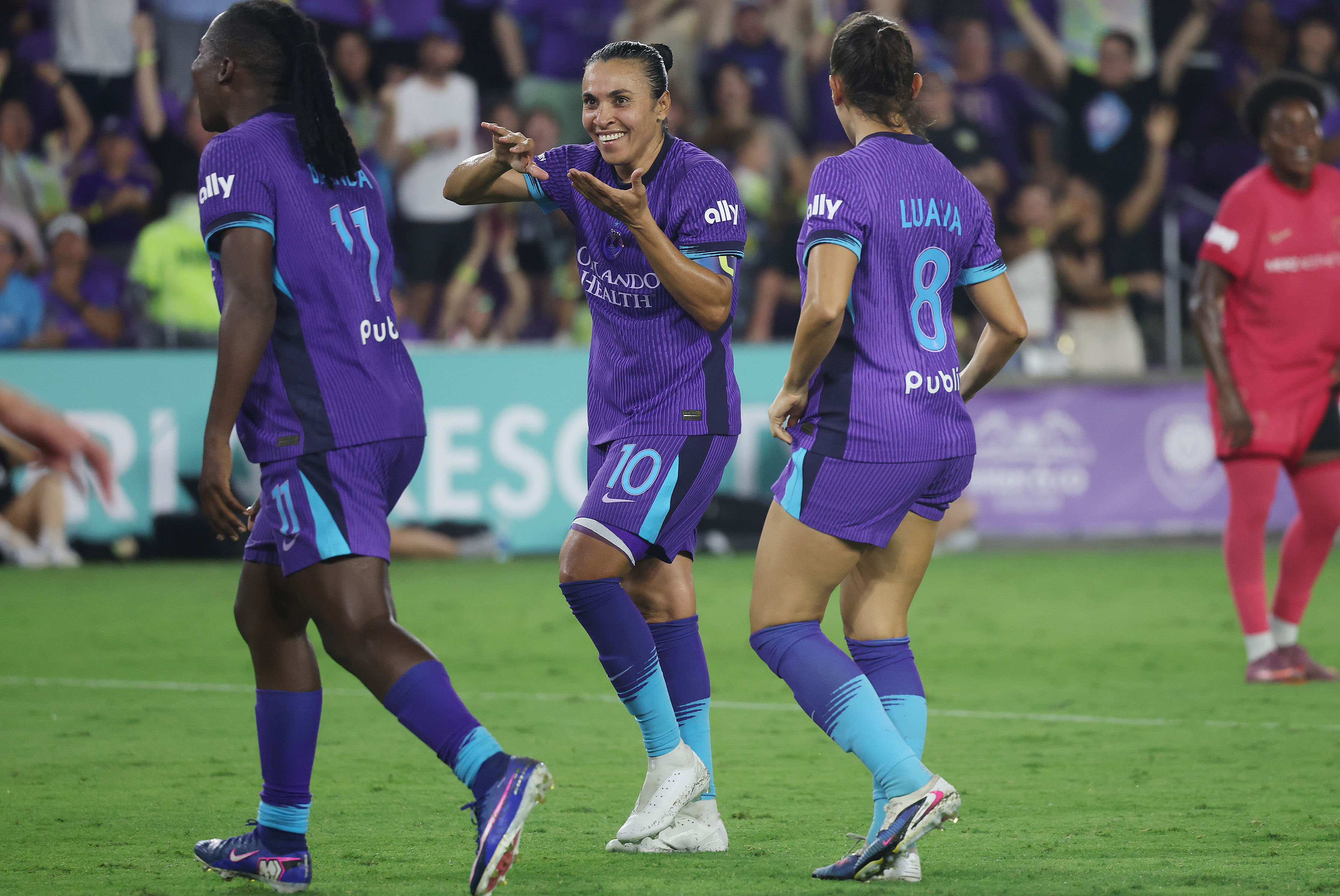 Orlando players Barbra Banda (11), Marta (10), and Luana (8)...