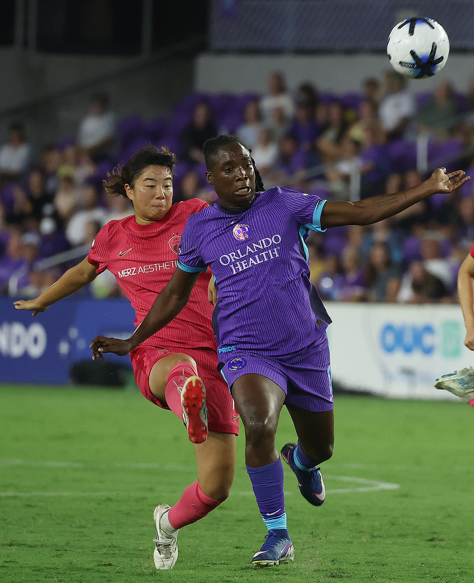 Orlando player Barbra Banda (right) chases the ball in front...