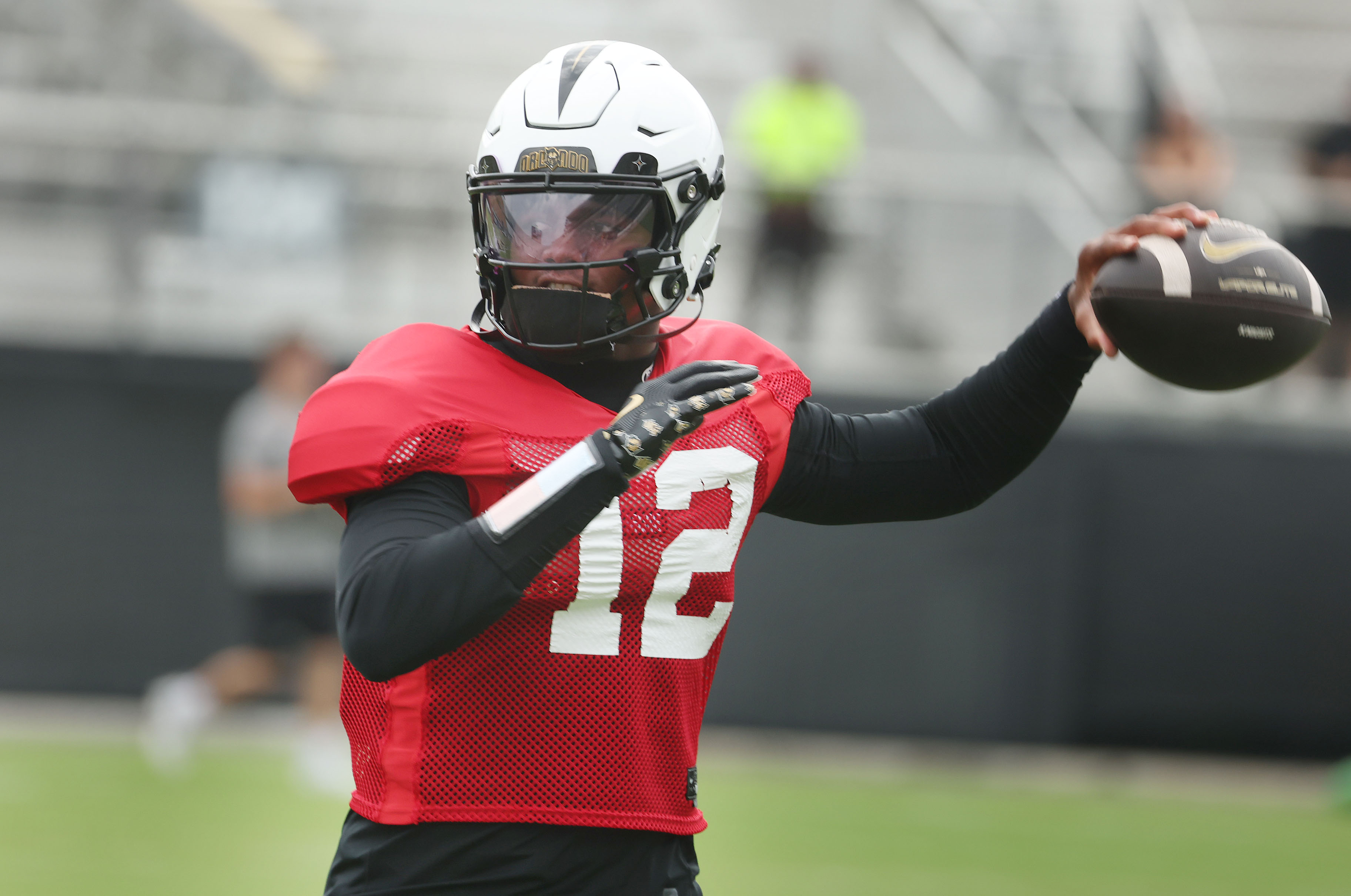UCF quarterback Keyone Jenkins throws during UCF Football Open Practice...