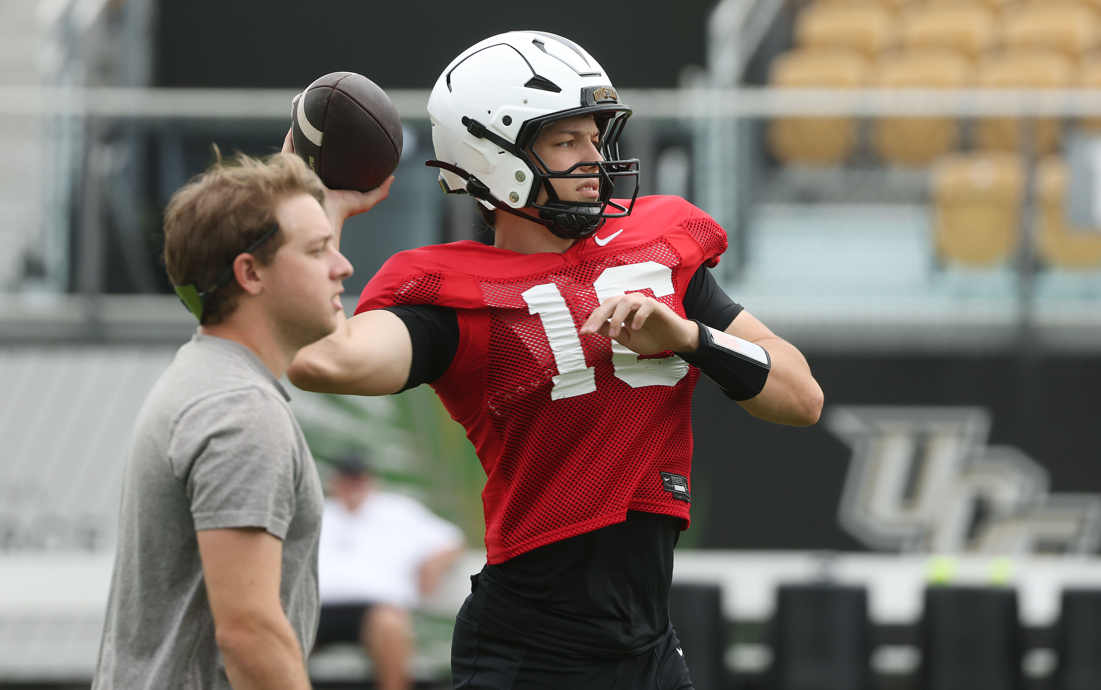 UCF quarterback Dante Carr throws during UCF Football Open Practice...