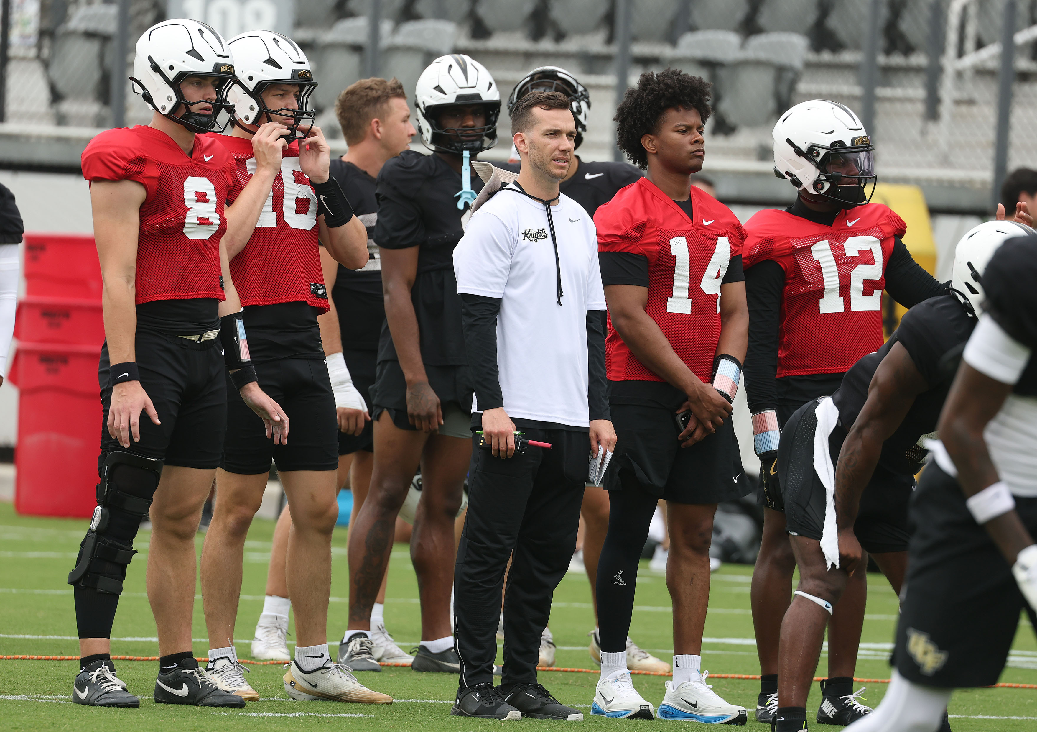 UCF quarterbacks coach McKenzie Milton (white shirt) is pictured with...