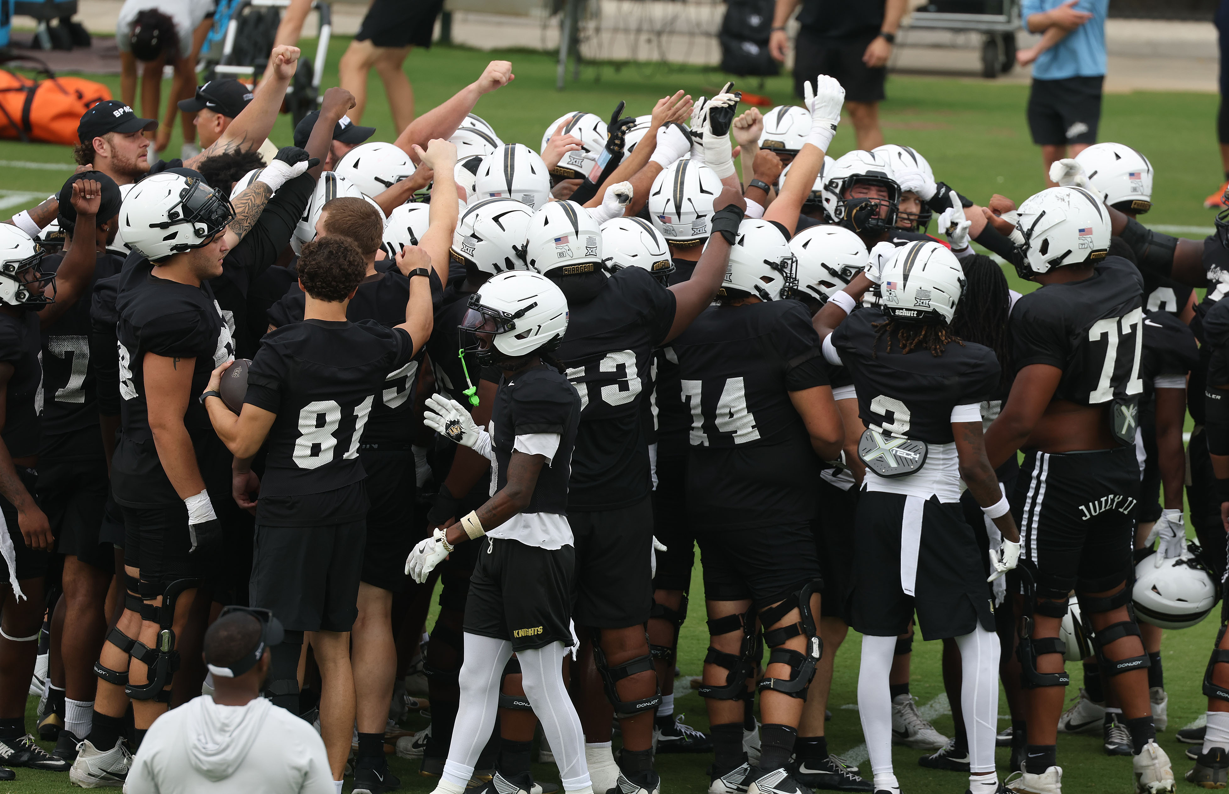 UCF players gather during UCF Football Open Practice at the...