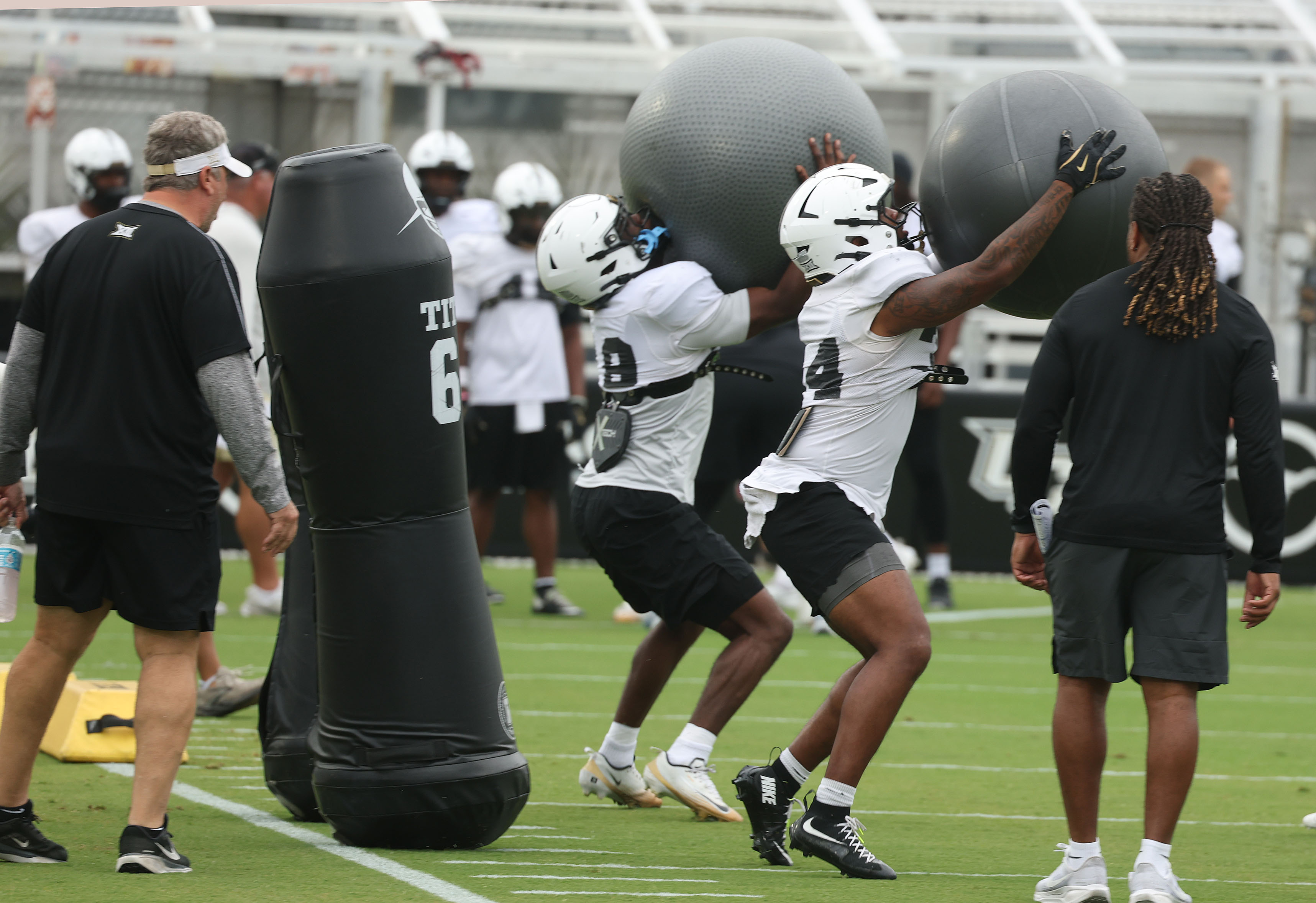 UCF players run drills during UCF Football Open Practice at...