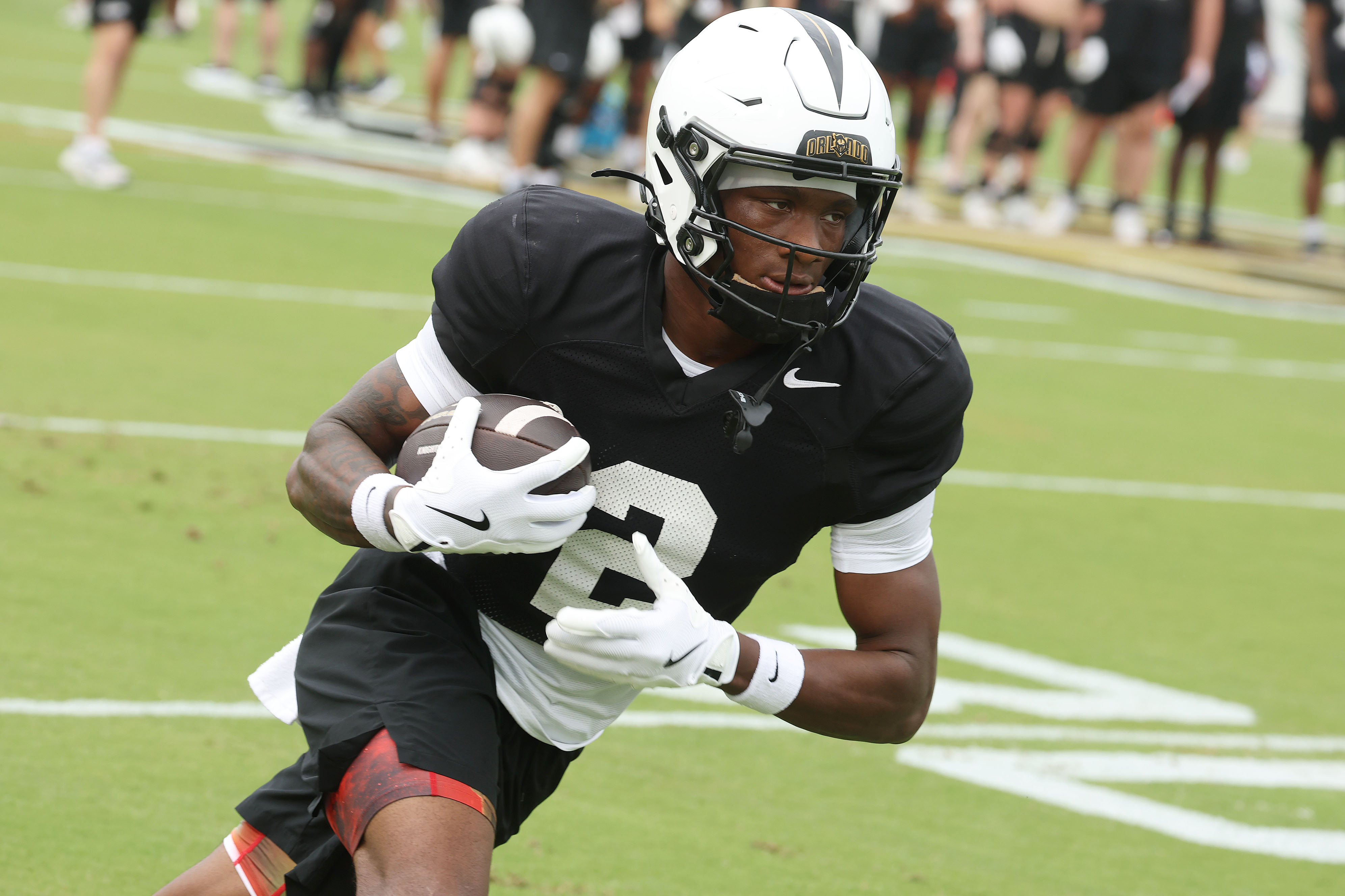 UCF receiver Tyren Hornes runs during UCF Football Open Practice...