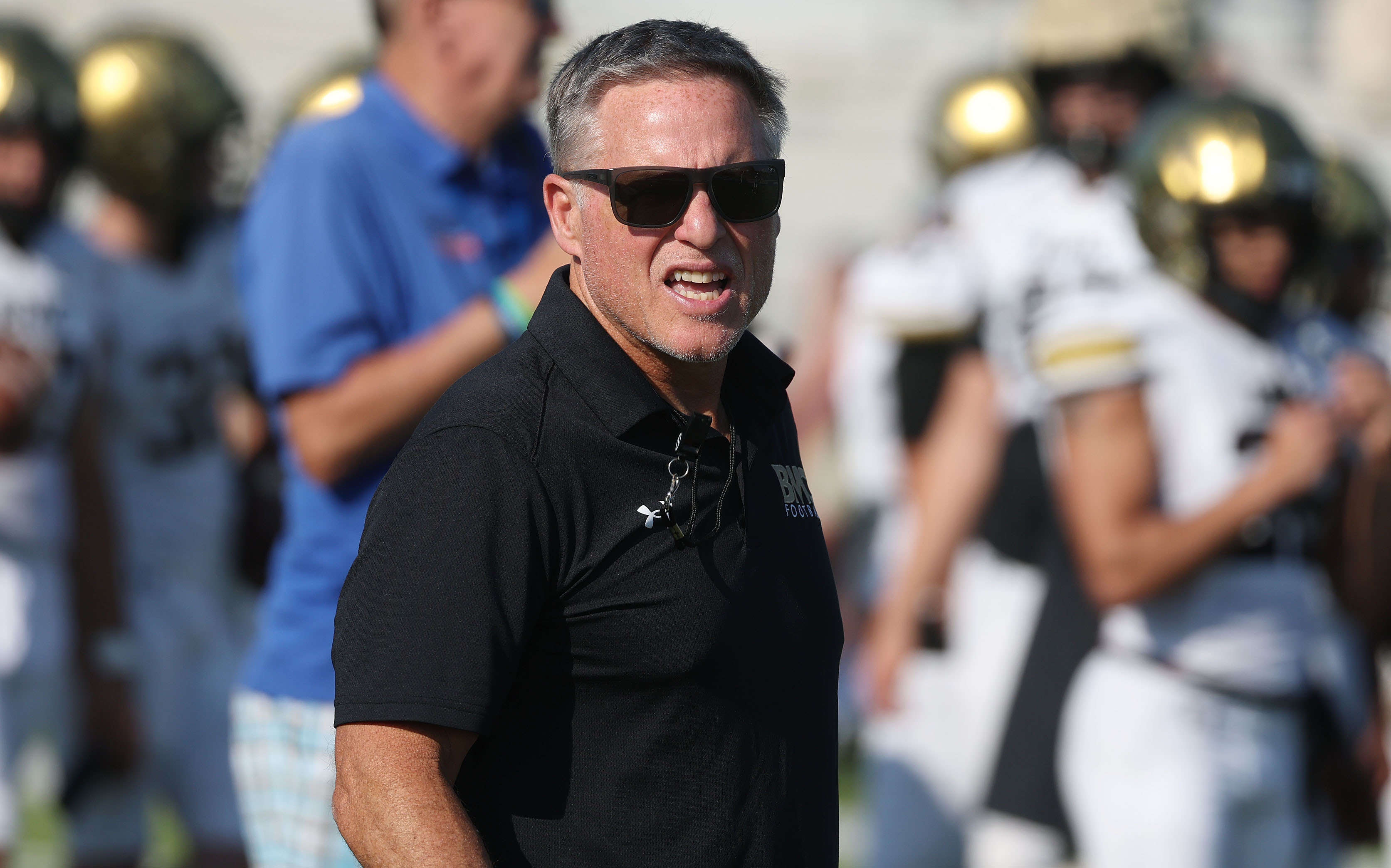 Bishop Moore coach Matt Hedrick coaches during a Spring High...