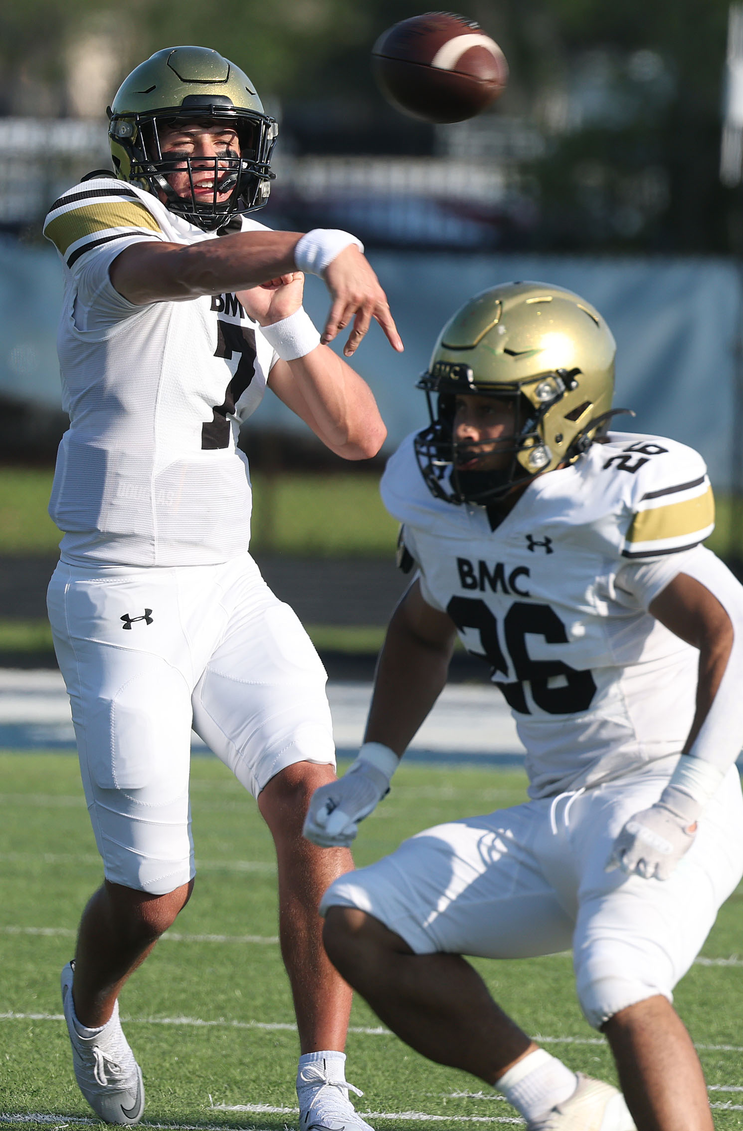 Bishop Moore quarterback Blake McCullough (7) throws during a Spring...