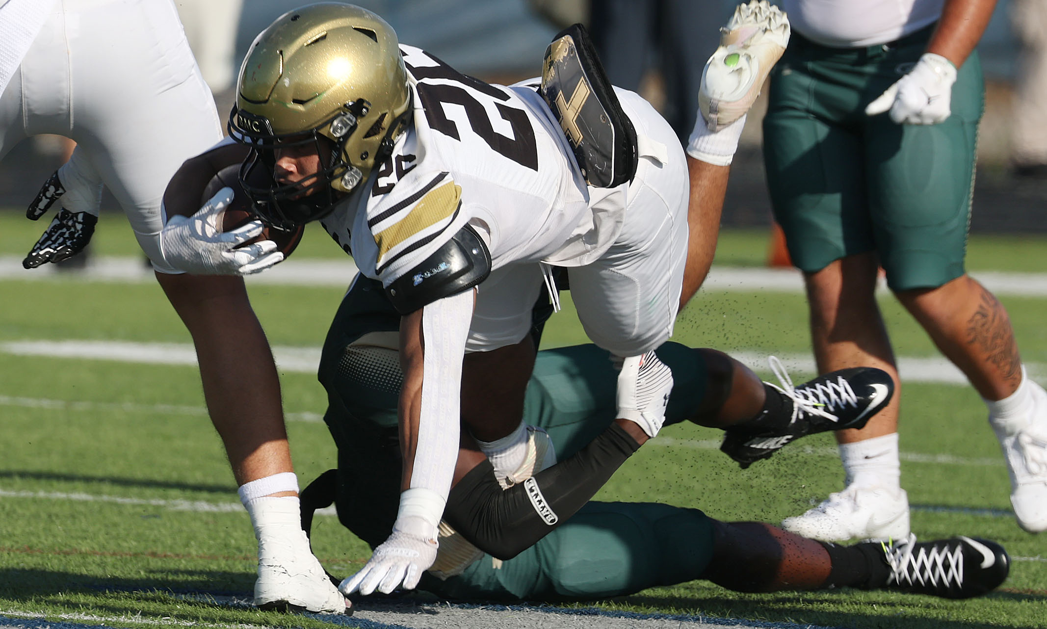 Bishop Moore running back Donovan Ferrufino (26) leaps during a...