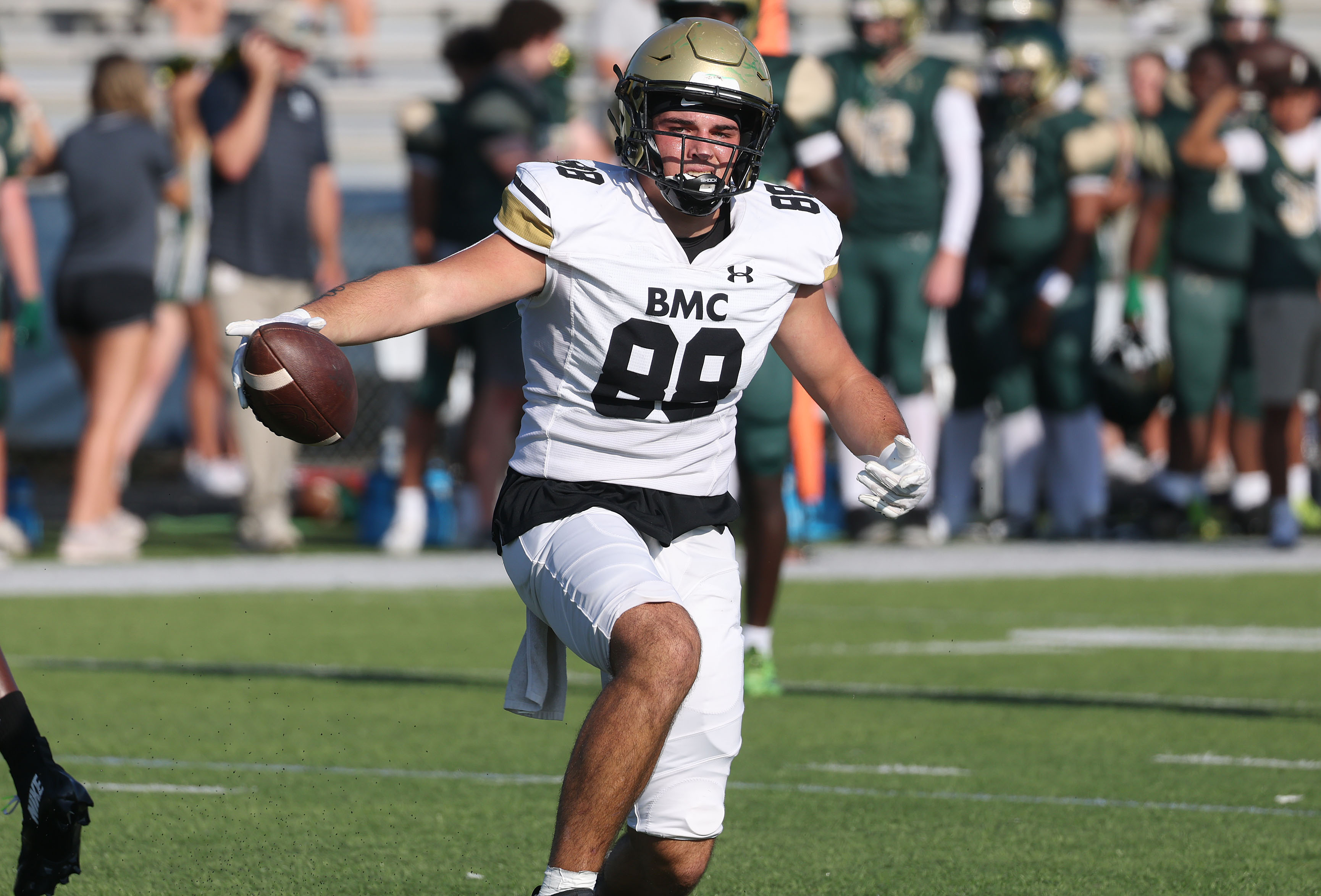 Bishop Moore tight end Drew Follett runs ater a catch...