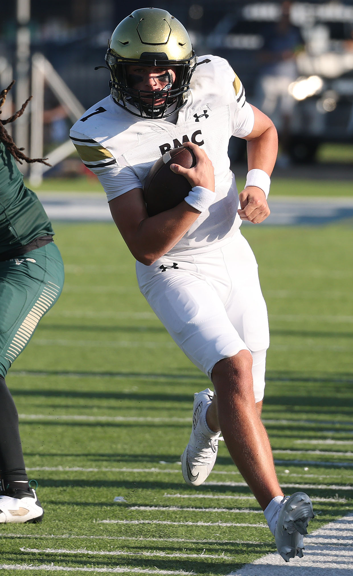Bishop Moore quarterback Blake McCullough (7) scrambles during a Spring...