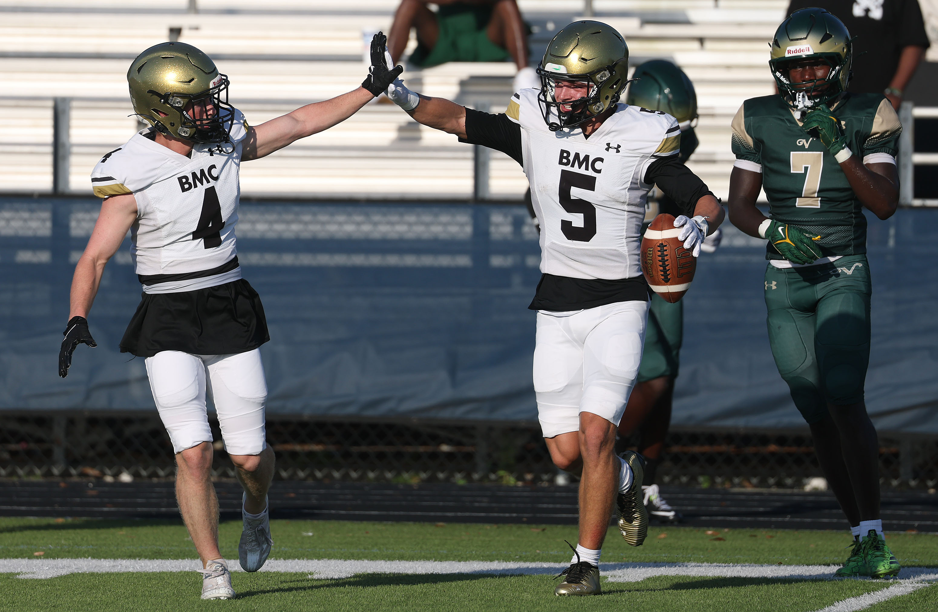 Bishop Moore players Matthew Sullivan (4) and Magnus Talma (5)...