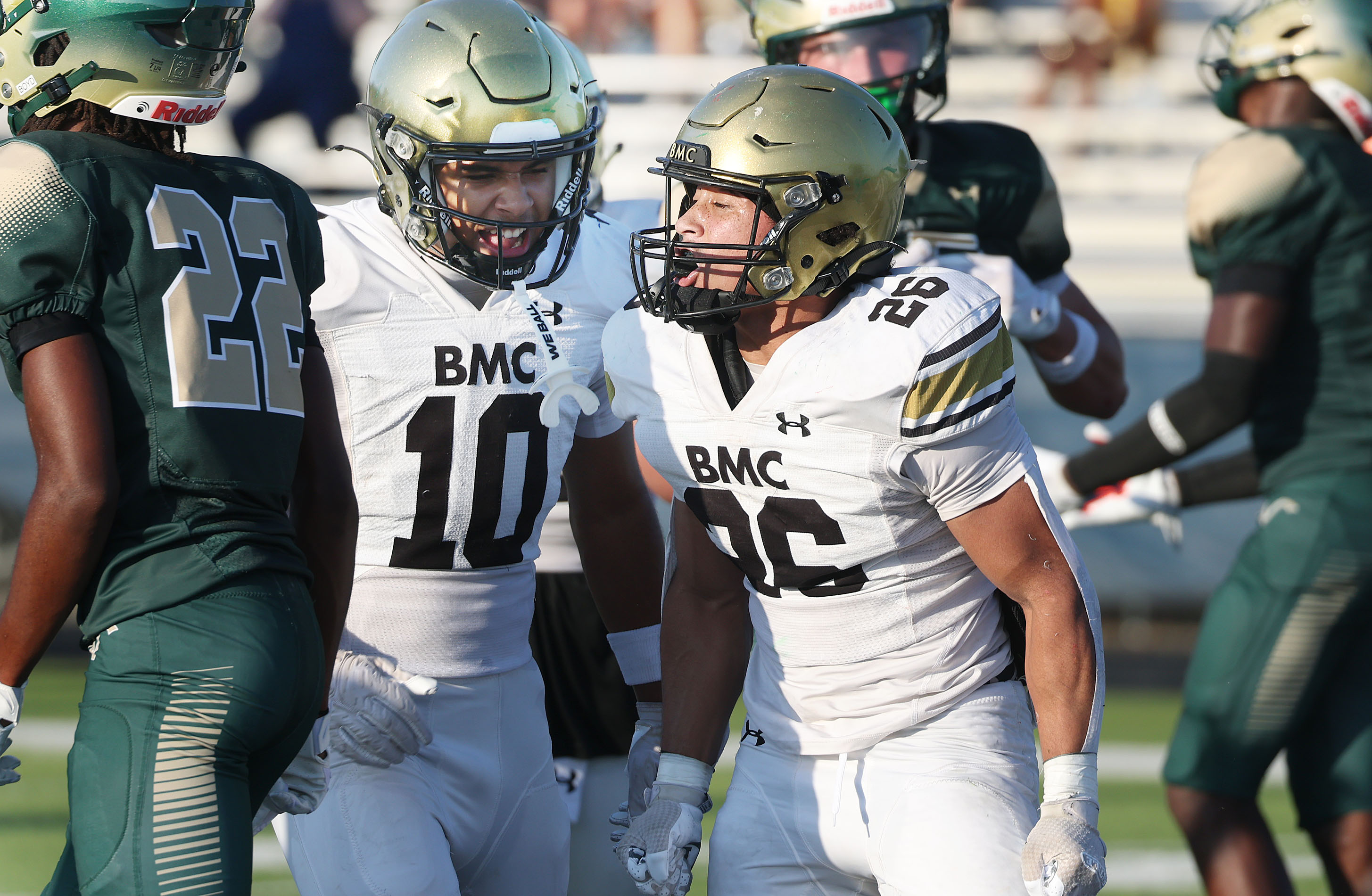 Bishop Moore running back Donovan Ferrufino (26) celebrates with teammate...