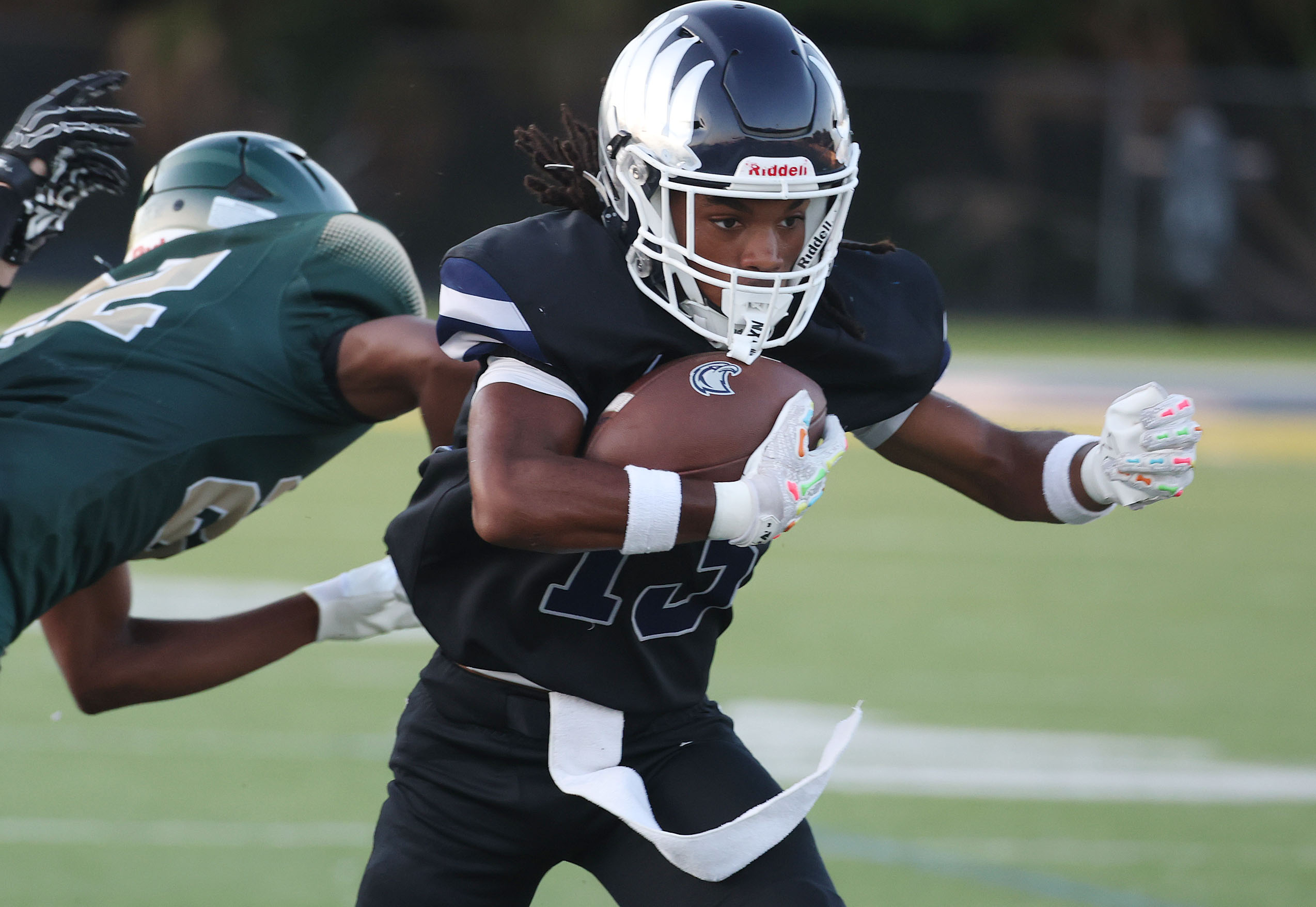 Lake Howell athlete Dexter Lee (13) runs during a Spring...