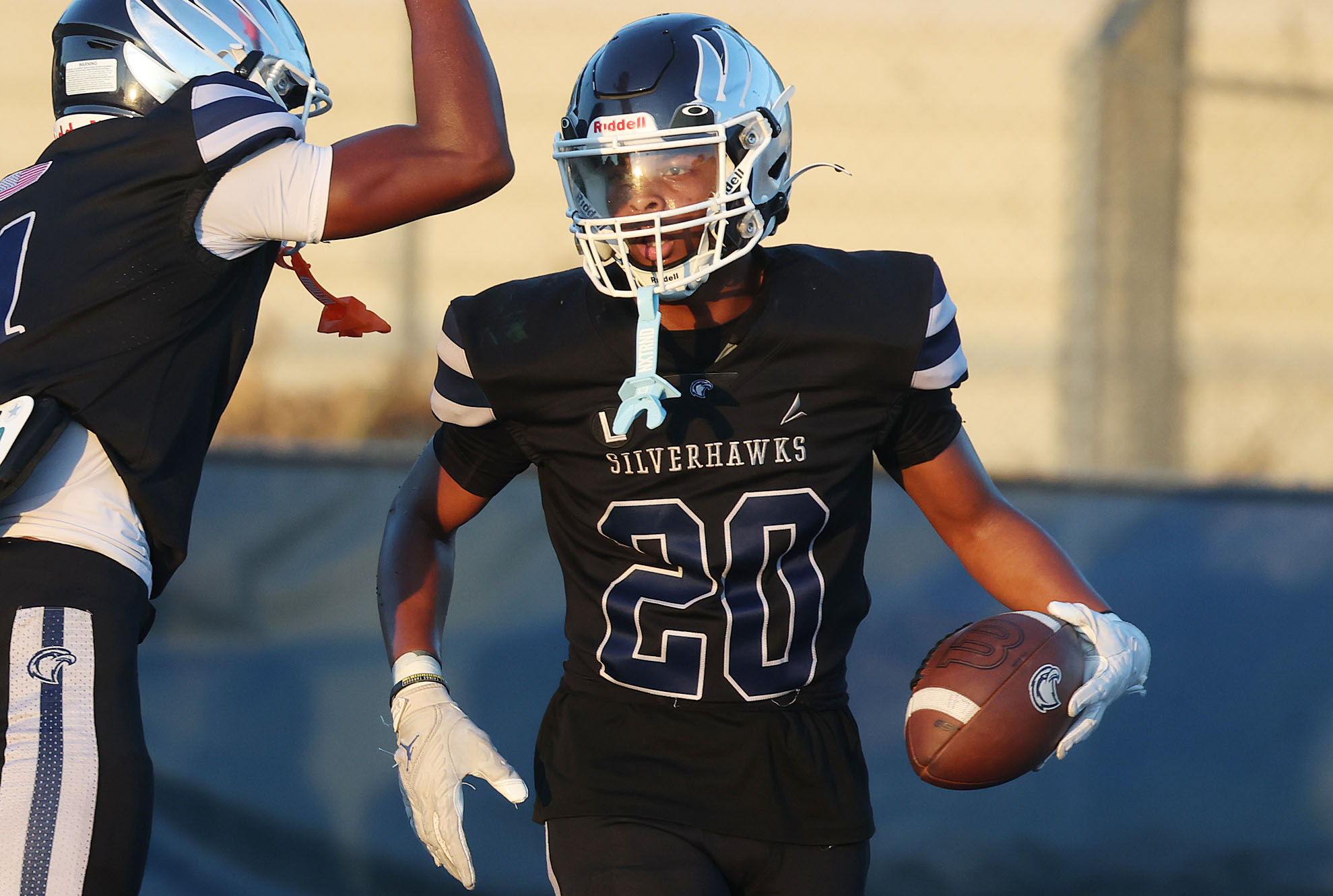 Lake Howell running back Darryl Hagger (20)( celebrates during a...