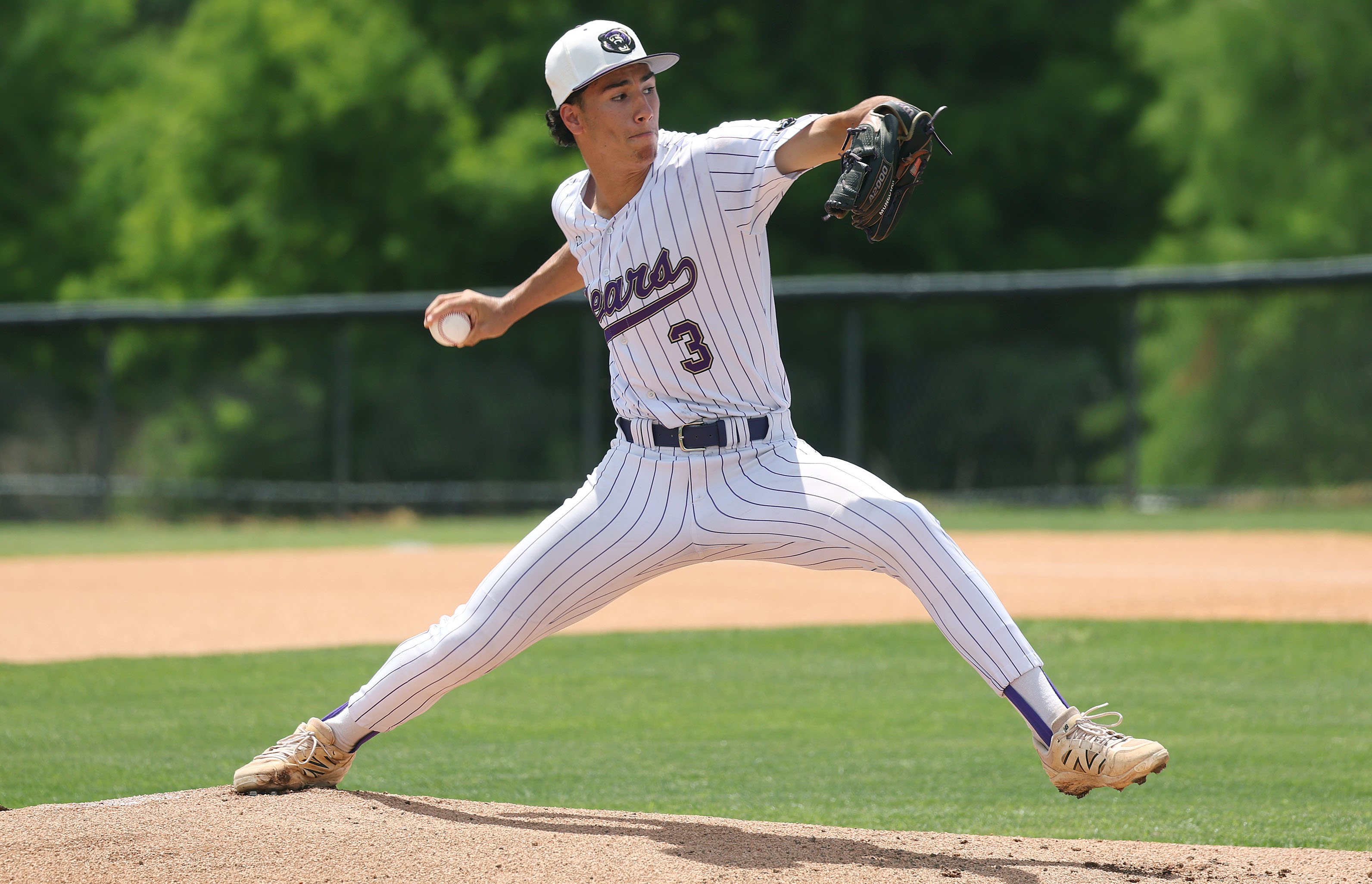 Winter Springs High baseball pitcher Robbie Mungovan throws during the...