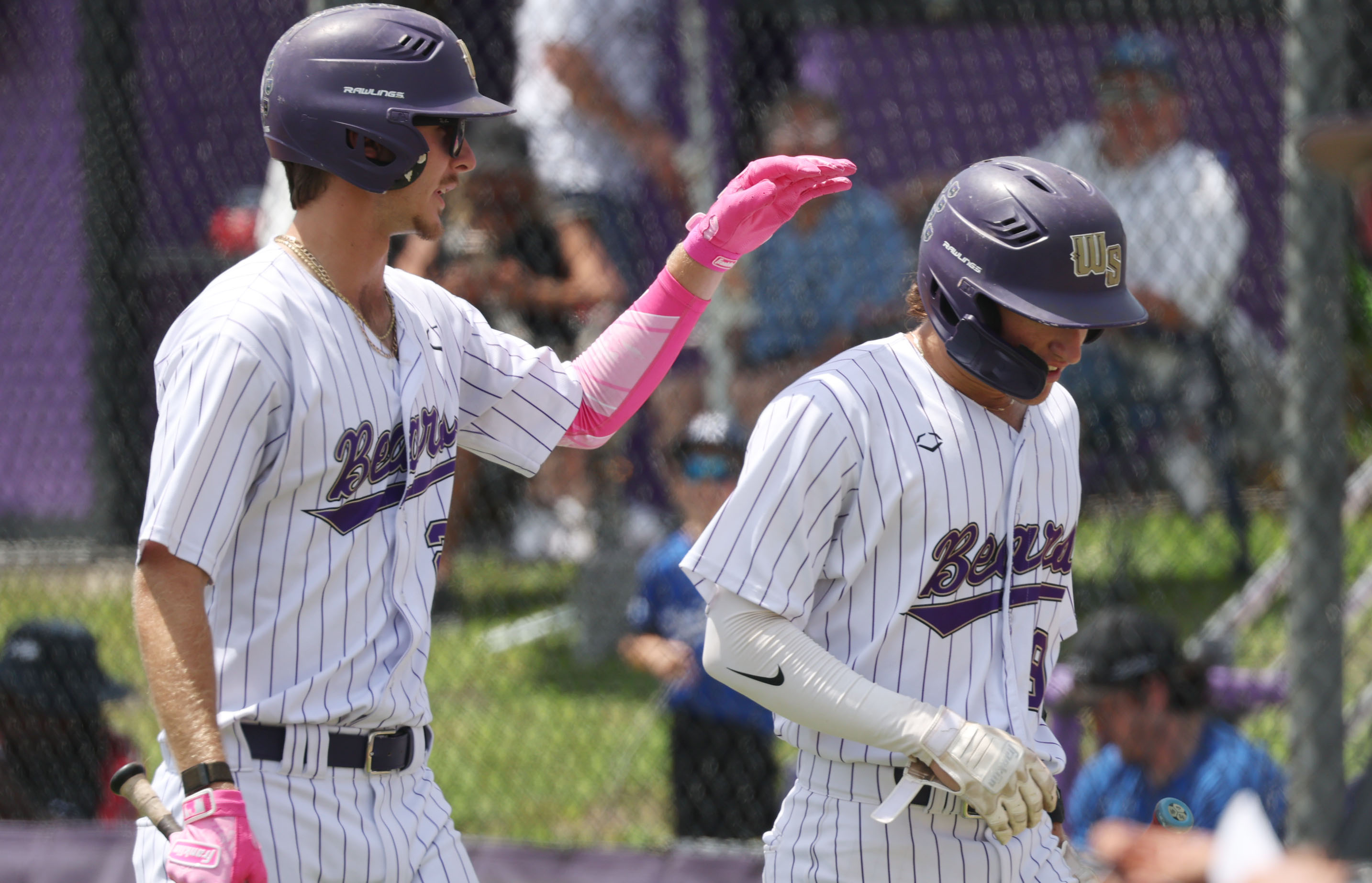 Winter Springs High baseball players Tyler Kenast (left) and Brandon...