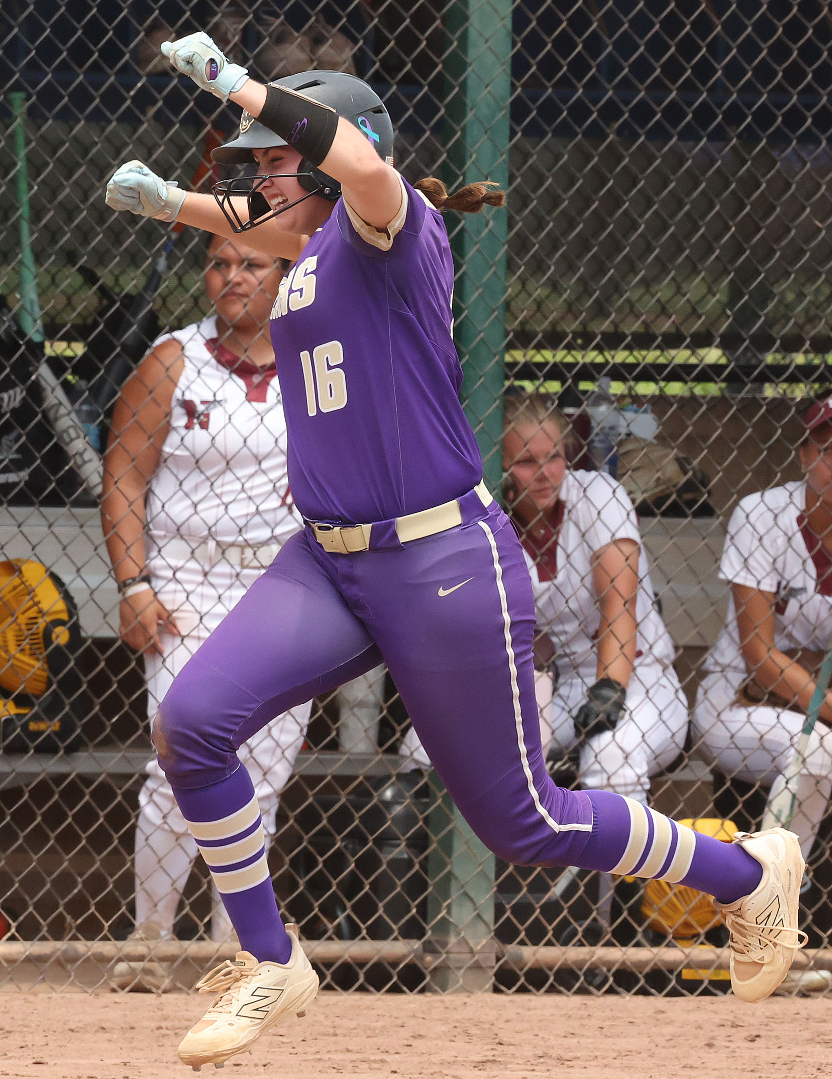 Winter Springs player Abigail Hooper (16) celebrates as she rounds...