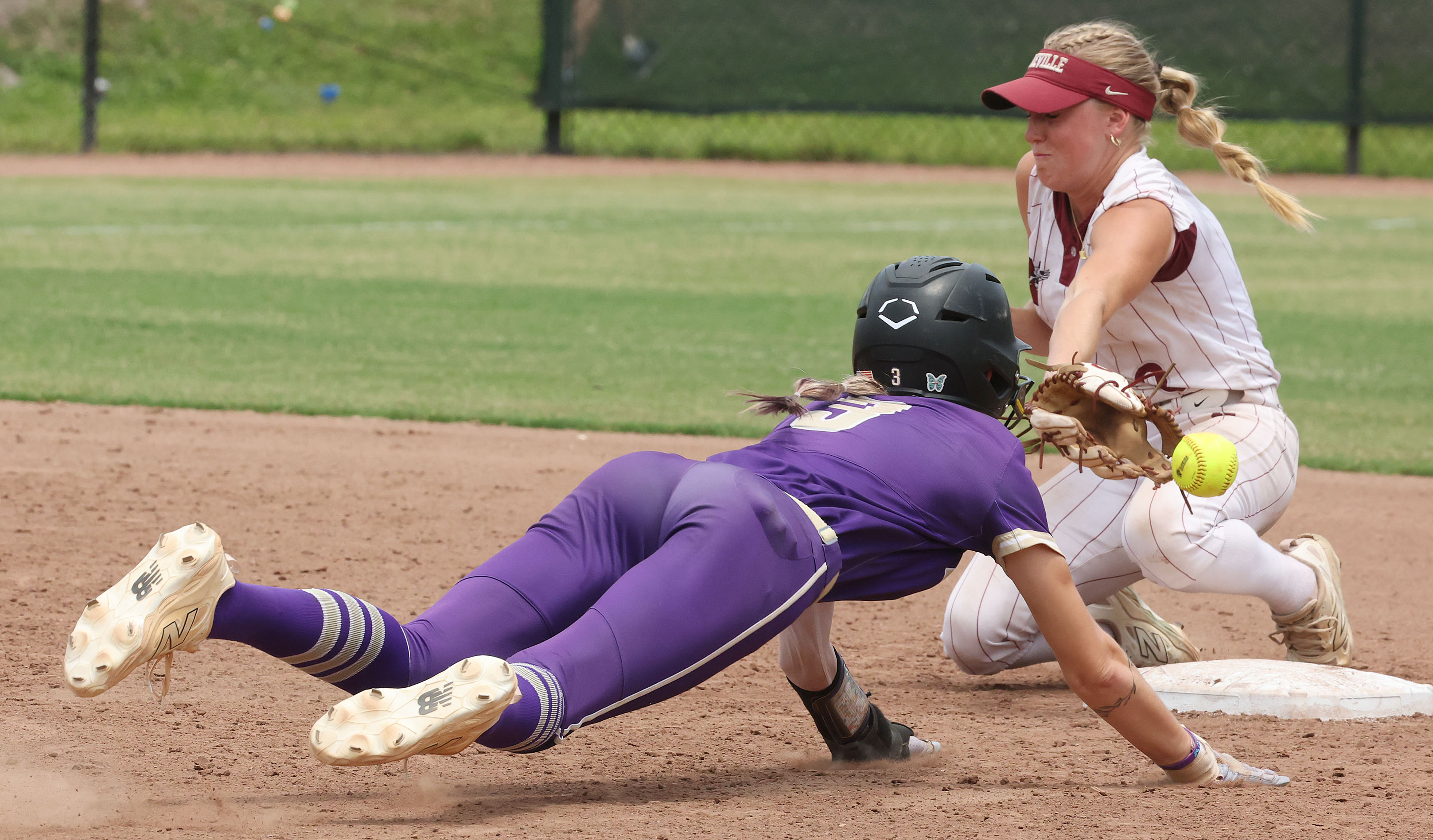 Winter Springs player Katelyn Wassey slides safely into second base...