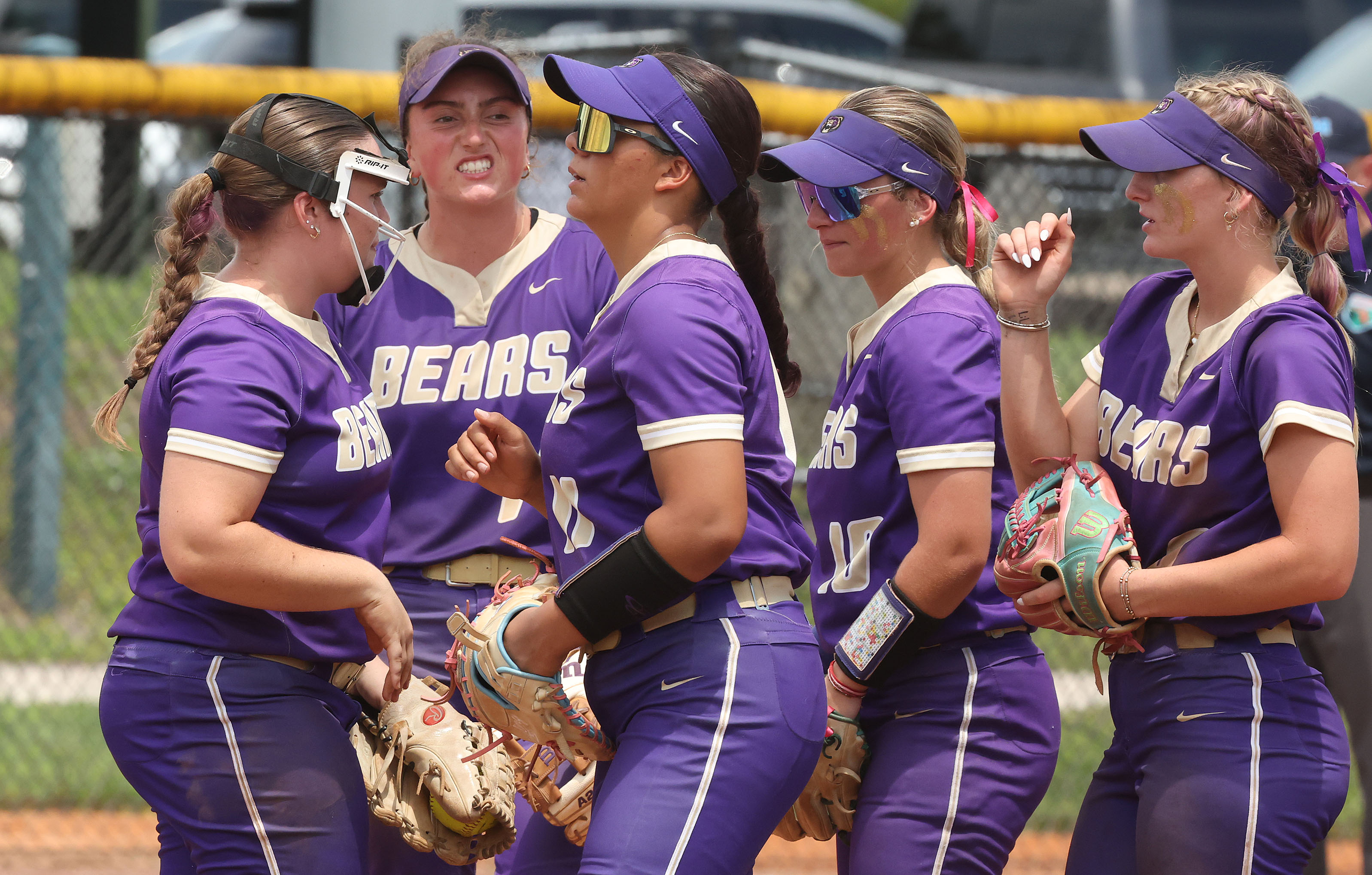 Winter Springs players gather during the Class 5A state softball...