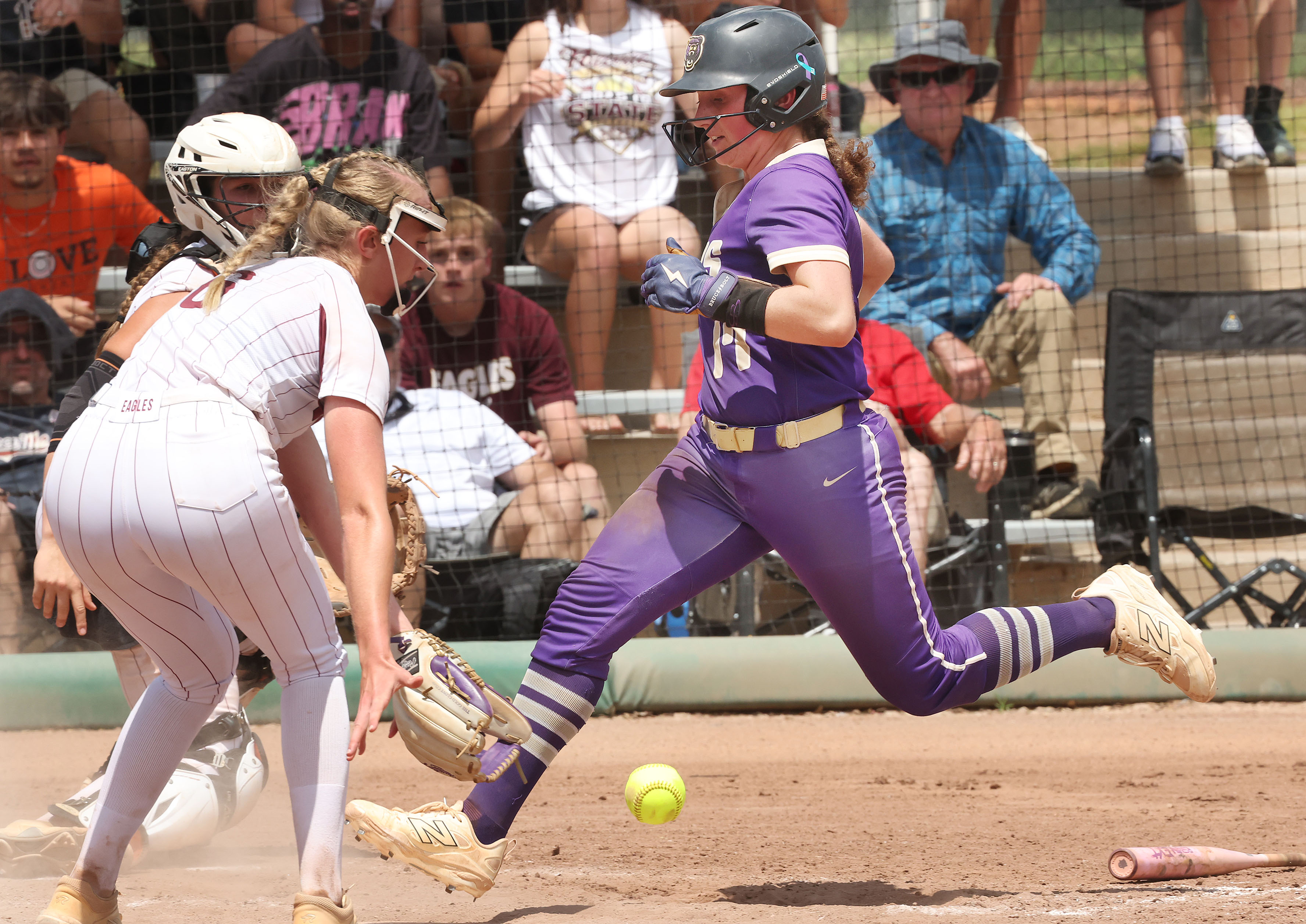 Winter Springs player Adison Pierce (17) crosses the plate ahead...