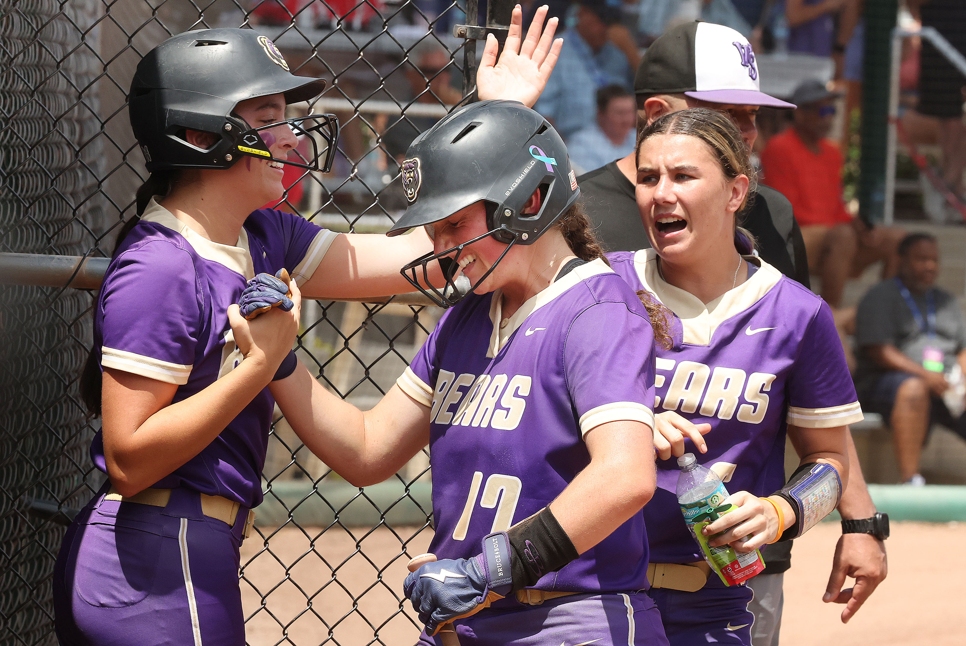 Winter Springs players congratulate Adison Pierce (17) after scoring during...