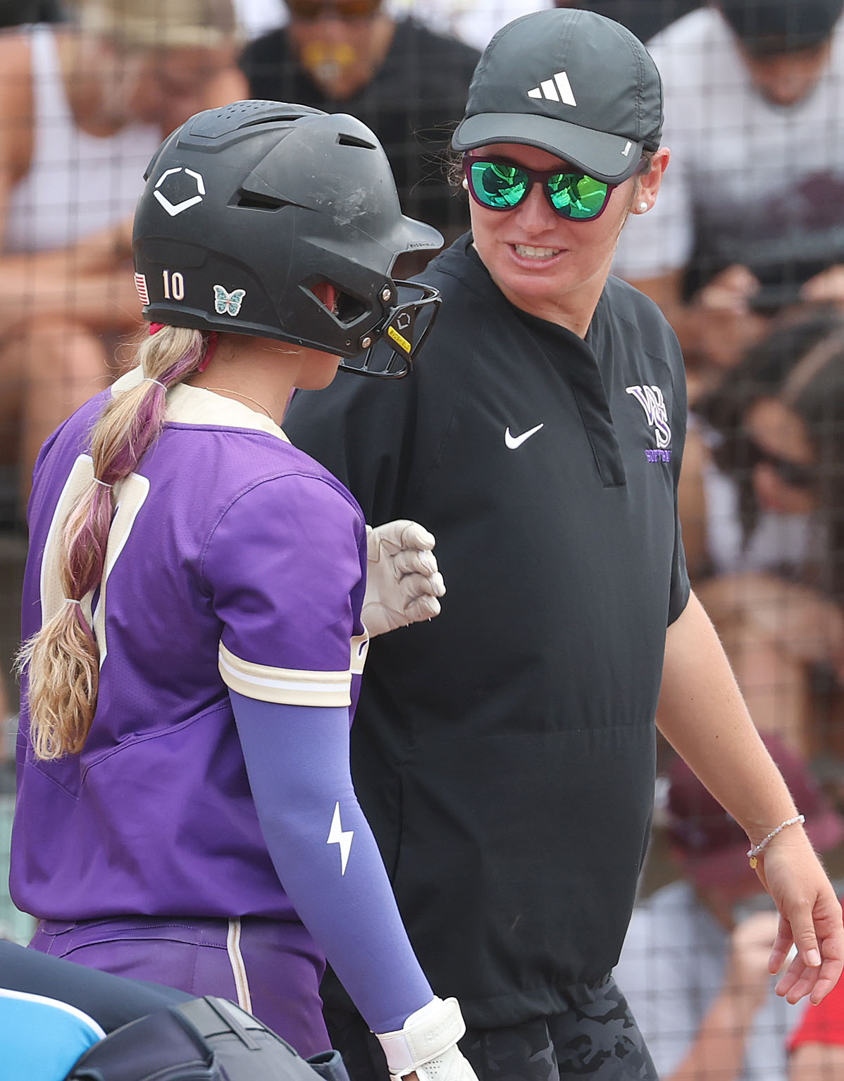 Winter Springs coach Farrah Gordon talks to player Miranda Rinne...