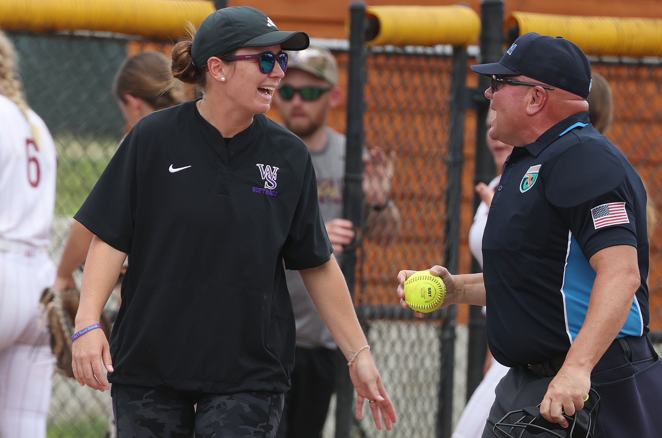 Winter Springs coach Farrah Gordon talks to a game official...