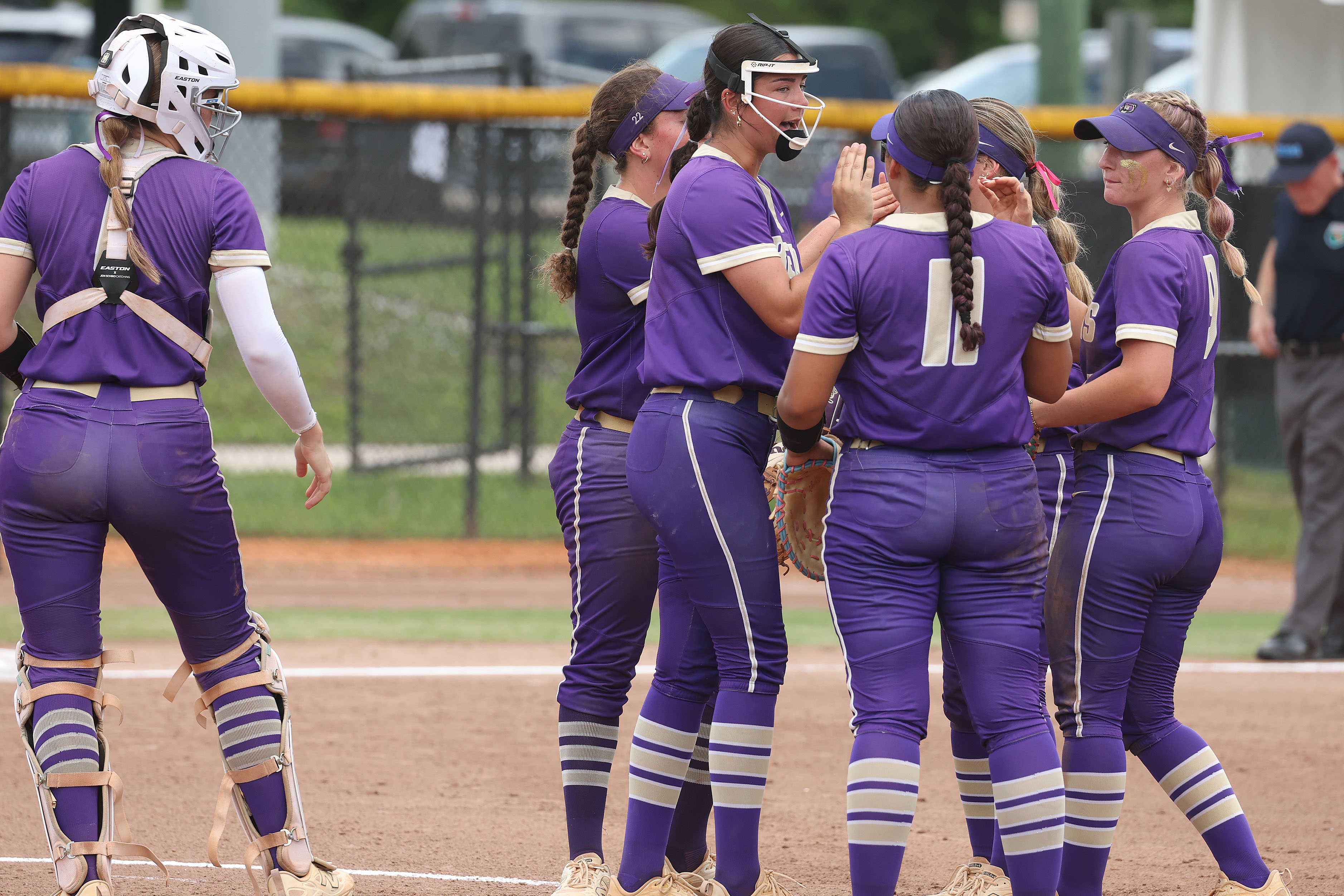Winter Springs players gather on the mound during the Class...