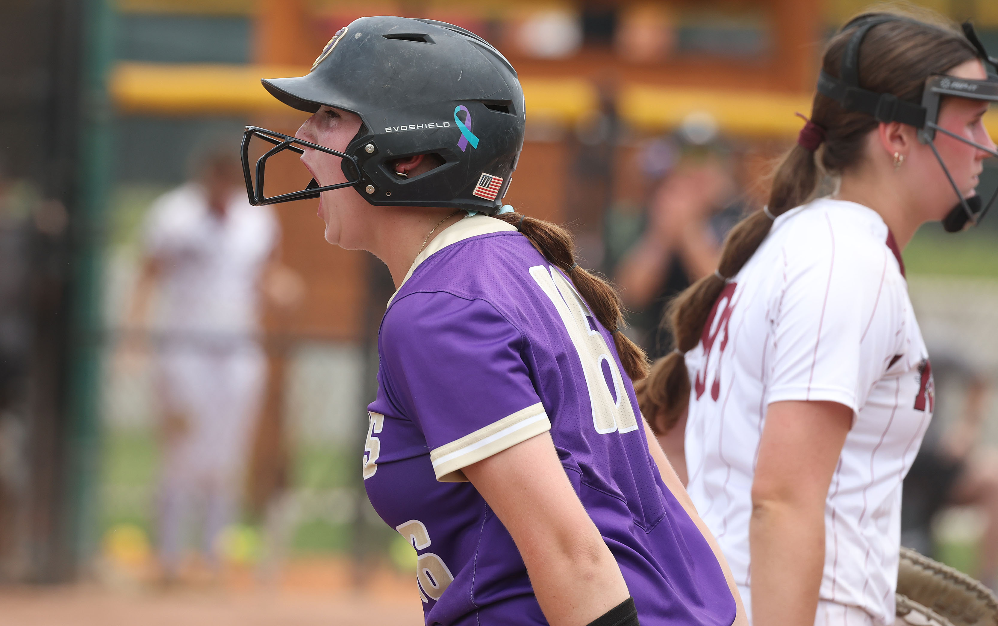 Winter Springs player Abigail Hooper screams at first base during...