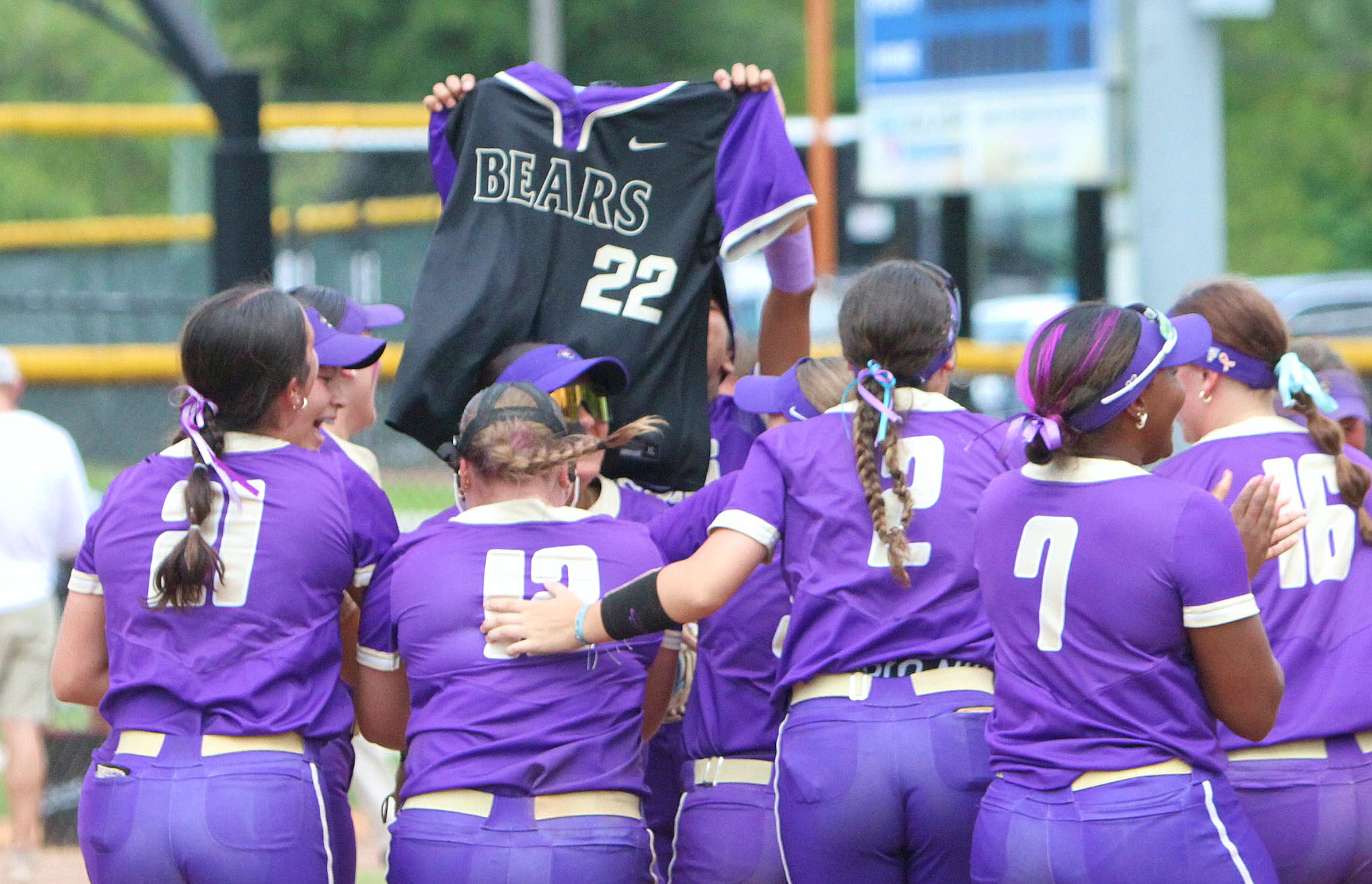 Winter Springs players rush the field after winning their second...