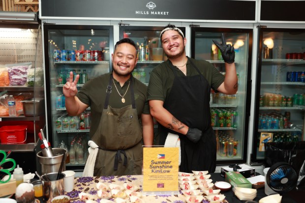 Kaya Executive Chef Lordfer Lalicon with staffer Tommy Buchanan at a previous Night Market event. (Photo courtesy Mills Market)
