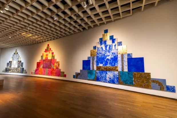 Visitors can see three towering pyramids of paintings crafted by Mette Tommerup, a Miami-based artist originally from Denmark, in the 2026 Florida Prize in Contemporary Art exhibition at the Orlando Museum of Art on May 26, 2026. (Patrick Connolly/Orlando Sentinel)