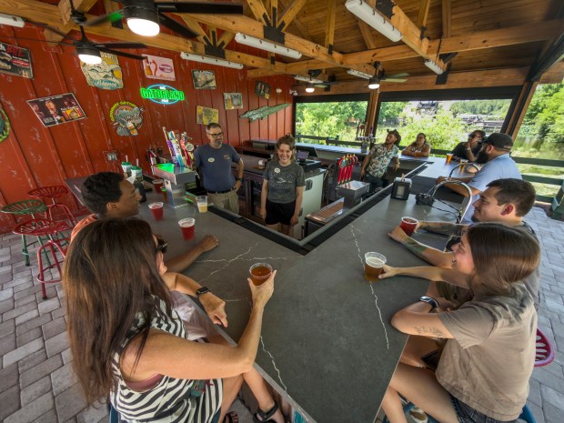 Scenes from Gatorland's new bar, the Guzzlin' Gator Beverage Barn, now open inside the South Orange Blossom Trail attraction. Gatorland has also partnered with Crooked Can Brewing Company of Winter Garden to offer the Grinnin' Gator lager at the location. (Gatorland)