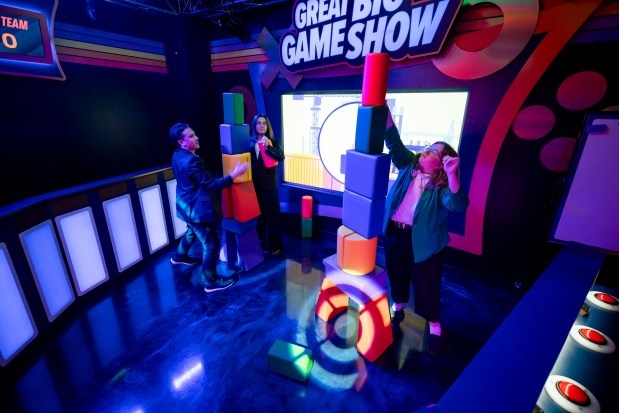 The Great Big Game Show on International Drive includes a game called "Build It Up" with foam building blocks. The experience offers mini games that give the feel of being on a TV game show. (Patrick Connolly/Orlando Sentinel)