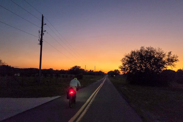 Patrick Connolly and Evan Sanders ride into dark for the second day in a row while navigating the Huracan bikepacking route on April 16, 2026. (Patrick Connolly/Orlando Sentinel)