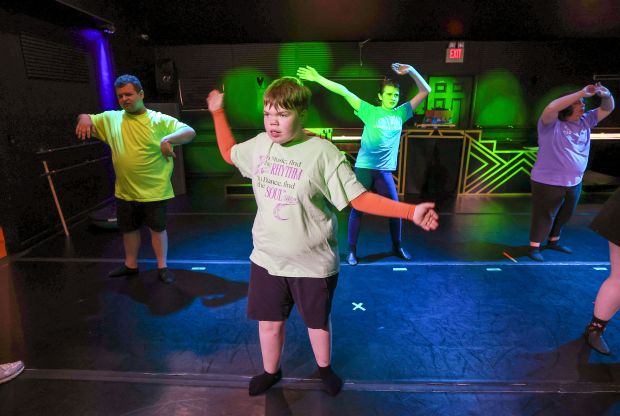 Tiem Strouse, center, who has autism and a a rare genetic disorder called ADNP, performs during rehearsal at the Chance 2 Dance studio in Maitland, Monday, May 4, 2026. (Joe Burbank/Orlando Sentinel)
