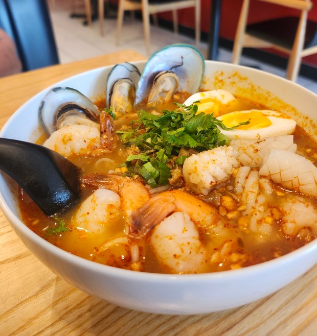 Tom yum seafood soup has nice heat at Lert Thai Street Food, a new spot near UCF. (Amy Drew Thompson/Orlando Sentinel)