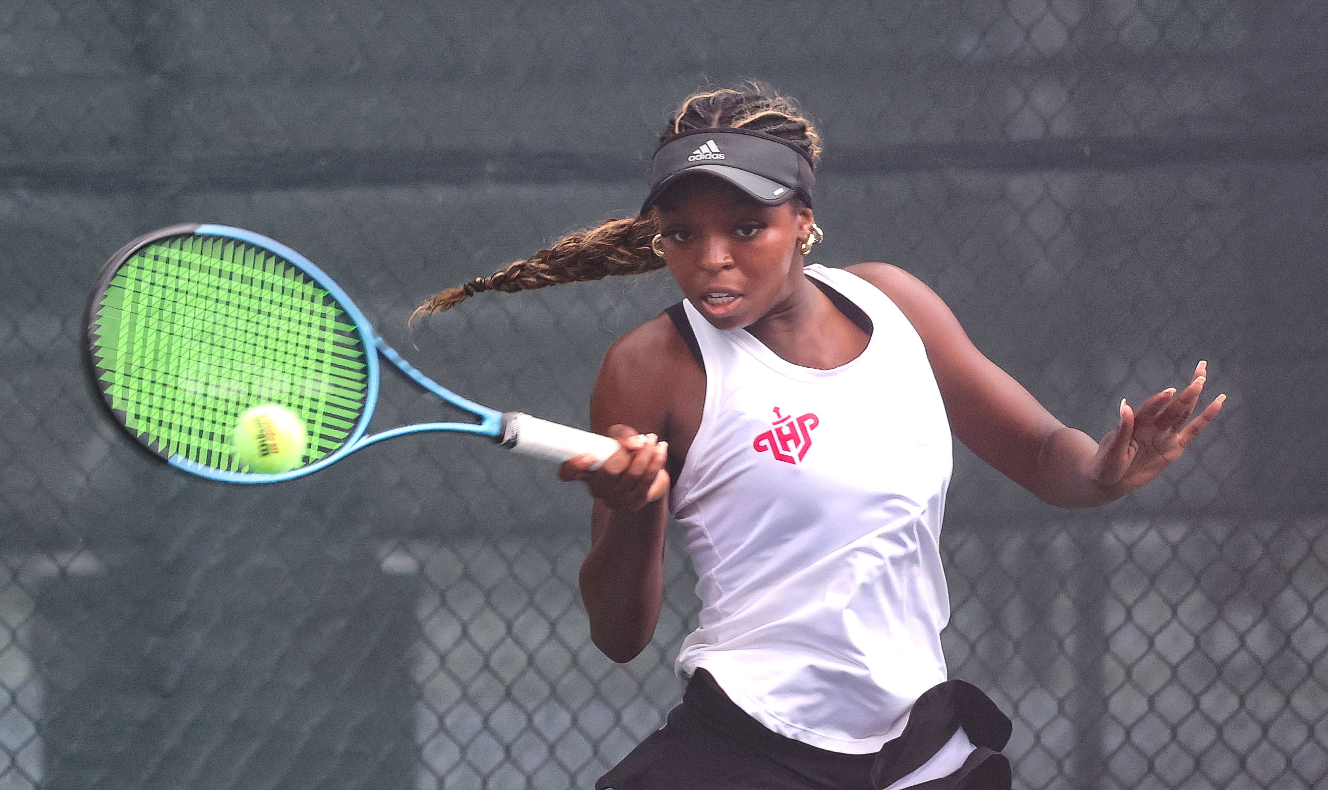 Lake Highland Prepâs Authumie Dhaiti rerturns a volley at the...